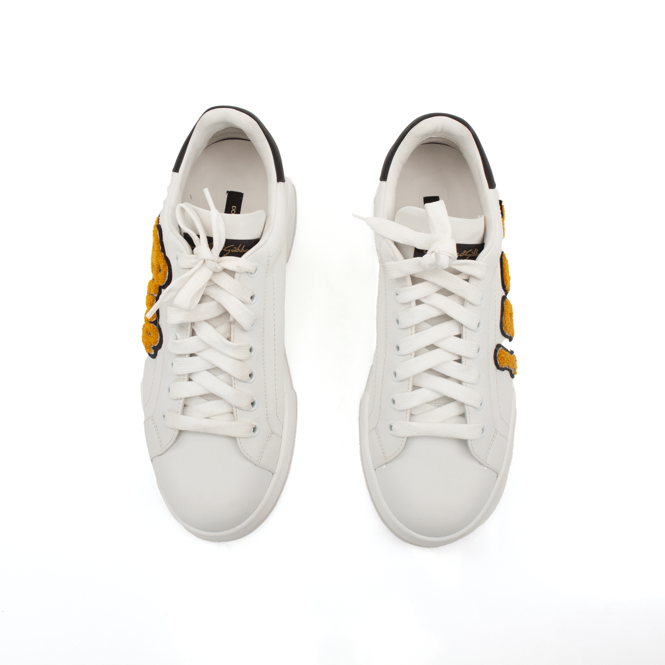Gold & Beyond Dolce & Gabbana sneakers, stylish shoes with intricate design and vibrant color accents, on a white background.