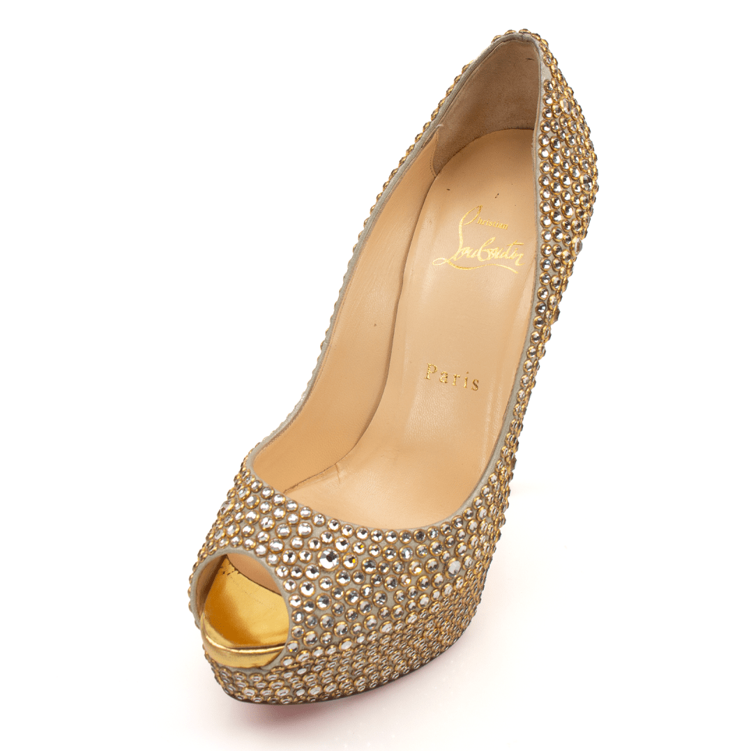 Christian Louboutin pumps by Gold & Beyond, elegant high-heeled shoes with signature red soles and sleek design.
