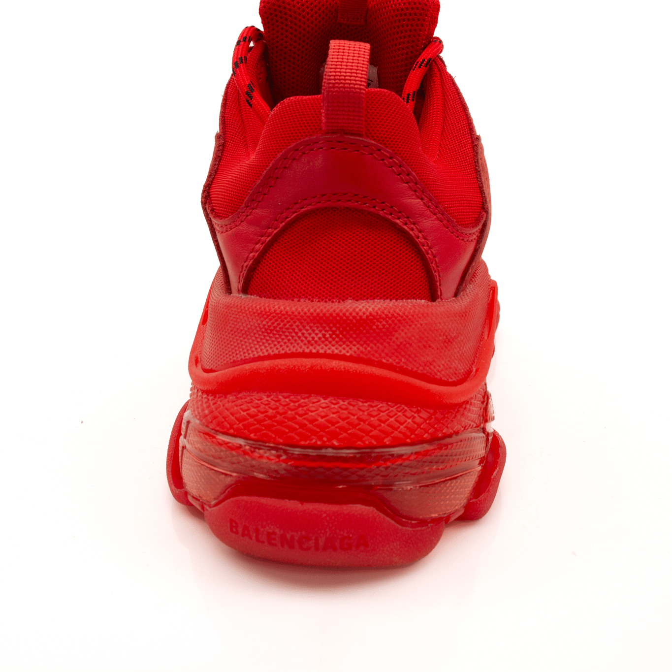 Gold & Beyond Balenciaga Triple S sneakers, chunky white and beige shoes with thick soles and stylish design.