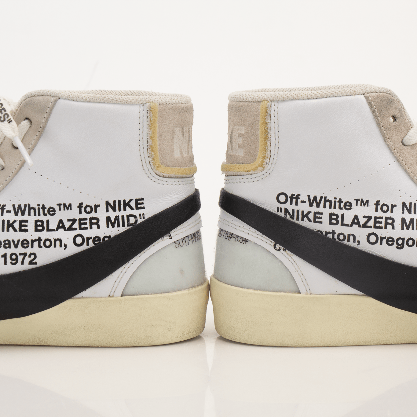 Nike x Off-White Blazer shoes featuring a white leather upper, black accents, and signature design details.