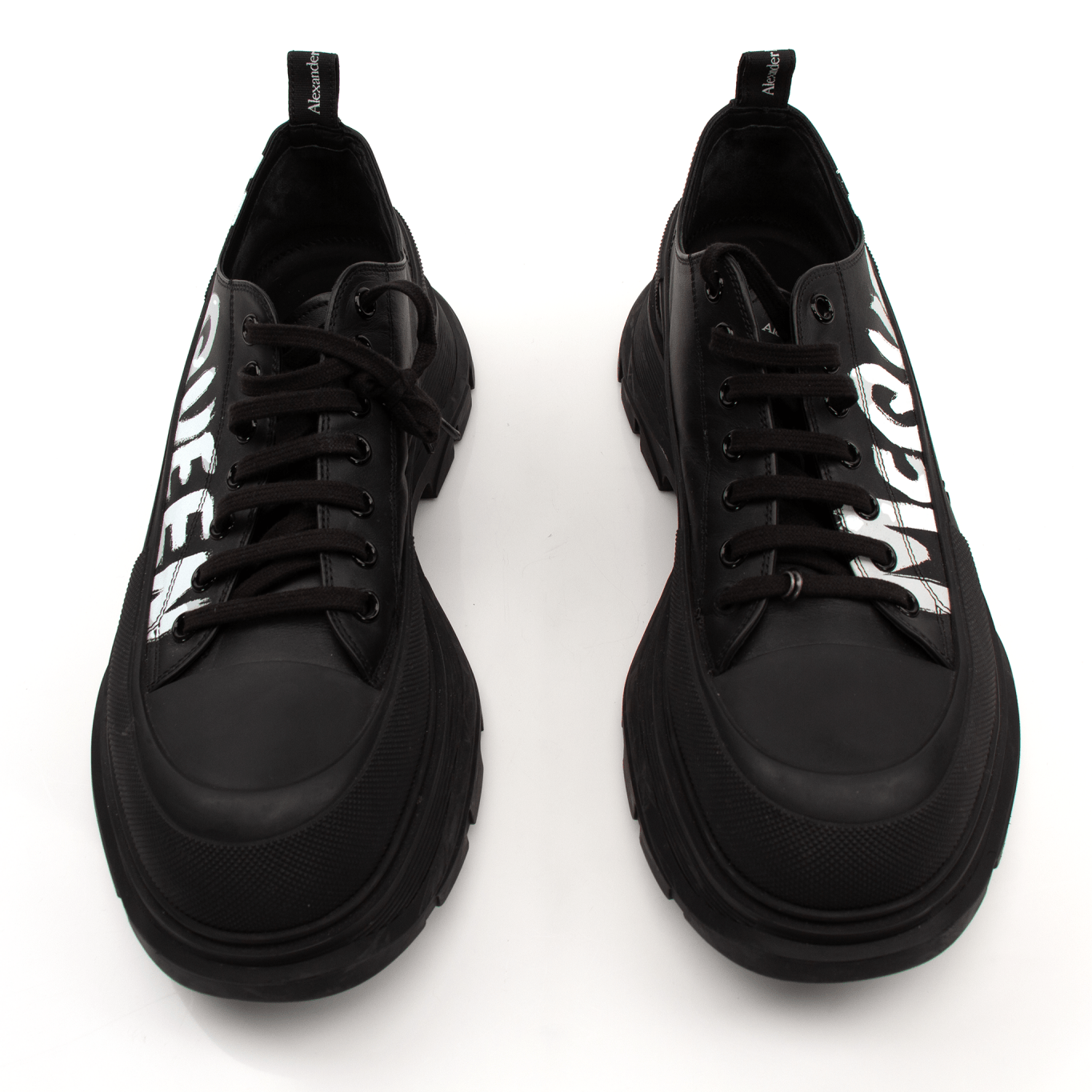 Alexander McQueen oversized sneakers by Gold & Beyond, stylish white shoes with chunky soles and minimalist design.
