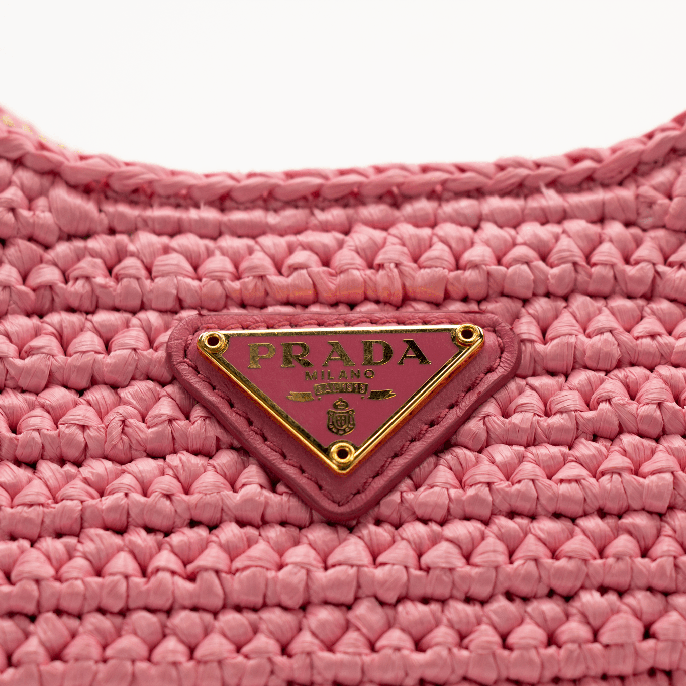 Pink Prada 2005 Re-Edition crochet handbag by Gold & Beyond, showcasing intricate crochet design and stylish craftsmanship.