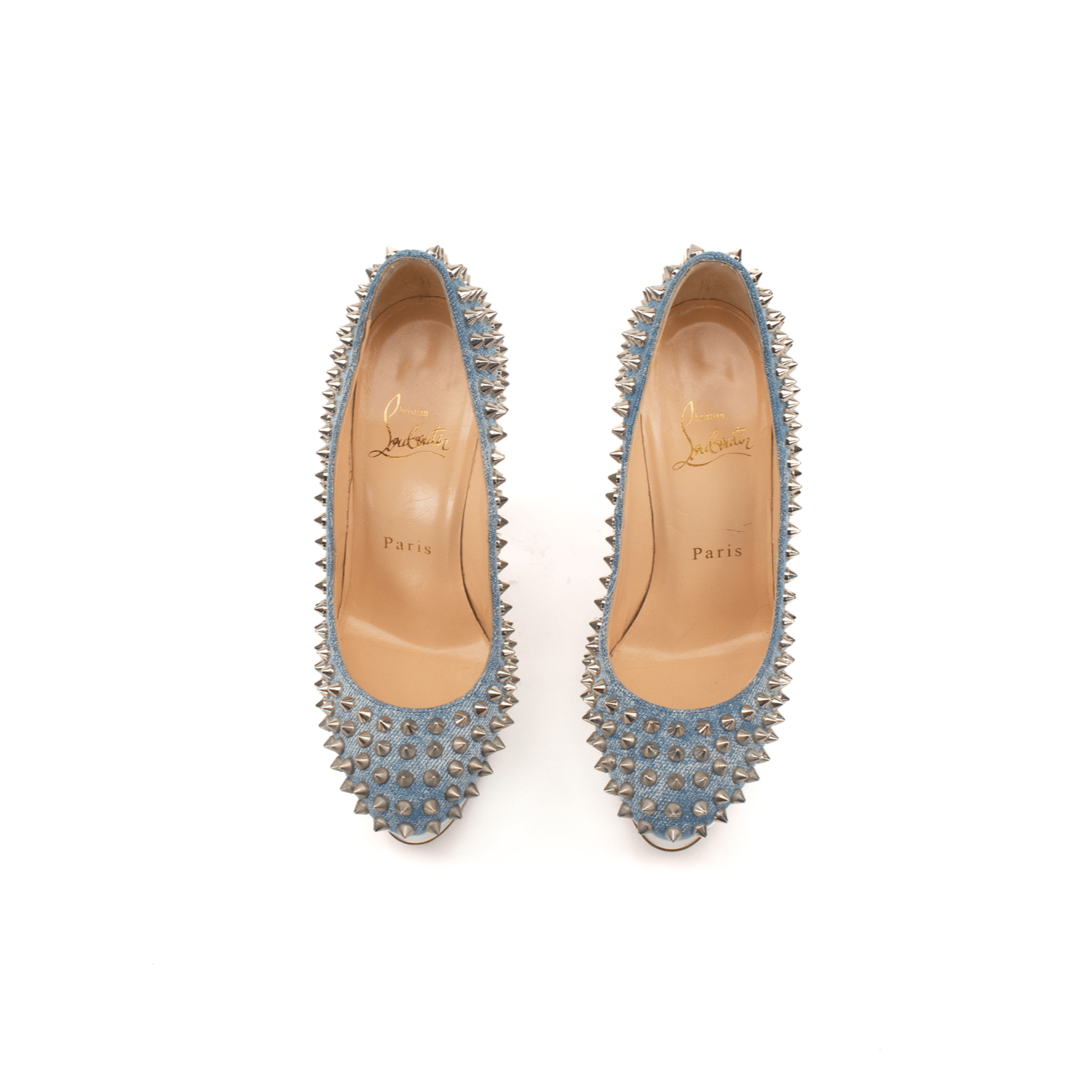 Christian Louboutin Bianca Spike Pumps, elegant black heels with signature red soles and gold spike details, worn on a model's feet.
