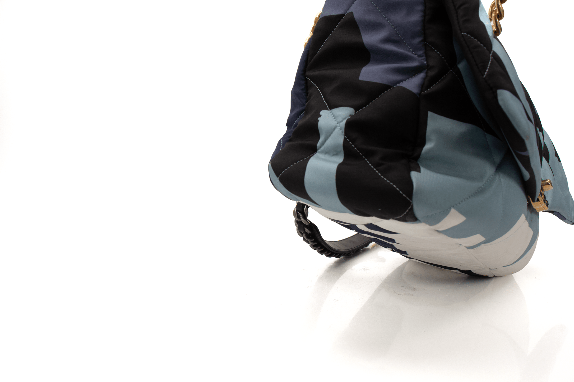 Chanel 19 Silk Flap handbag in elegant design, showcasing luxurious silk fabric and iconic Chanel branding.