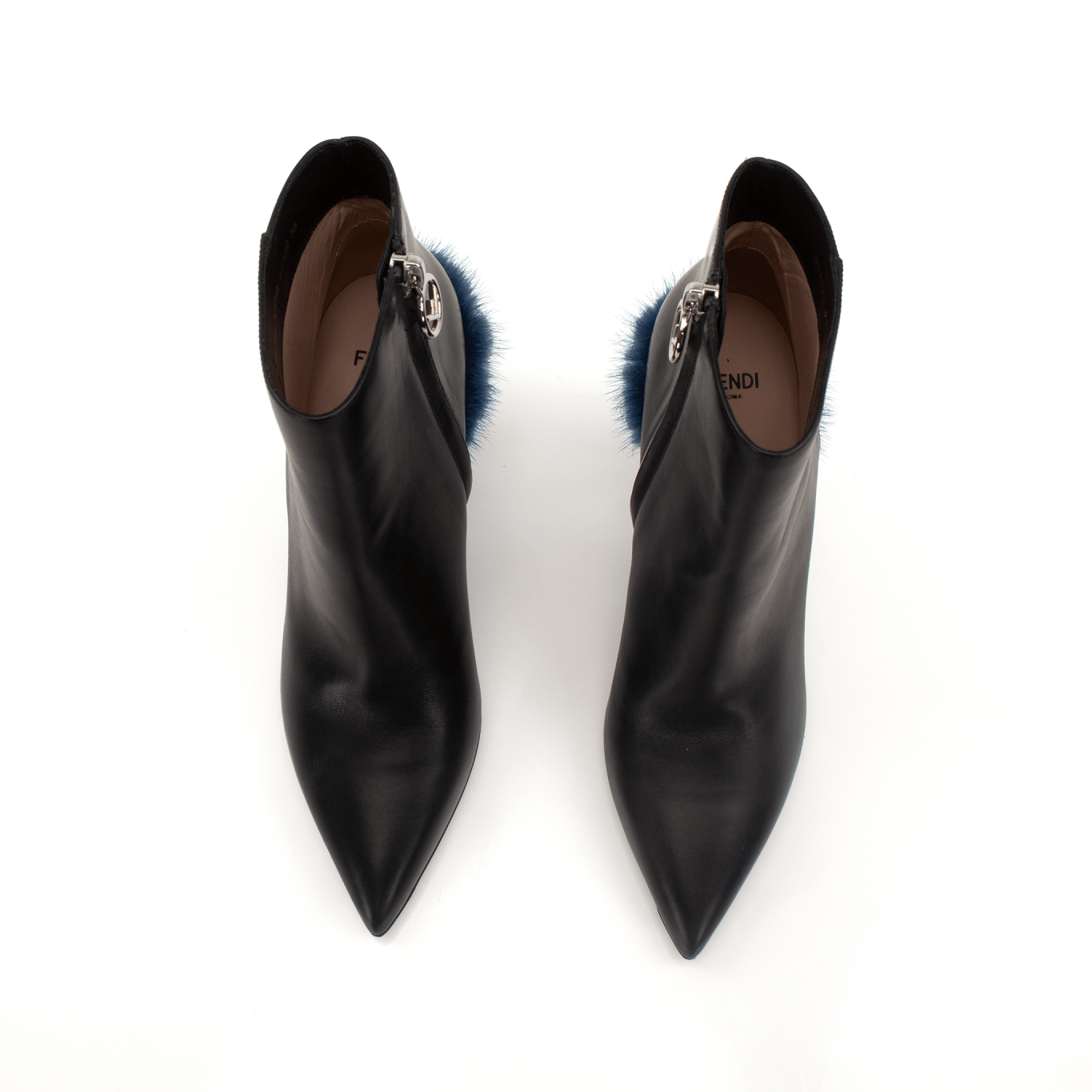 Black leather ankle boots by Fendi featuring sleek design, pointed toes, and stylish ankle-high cut from Gold & Beyond.