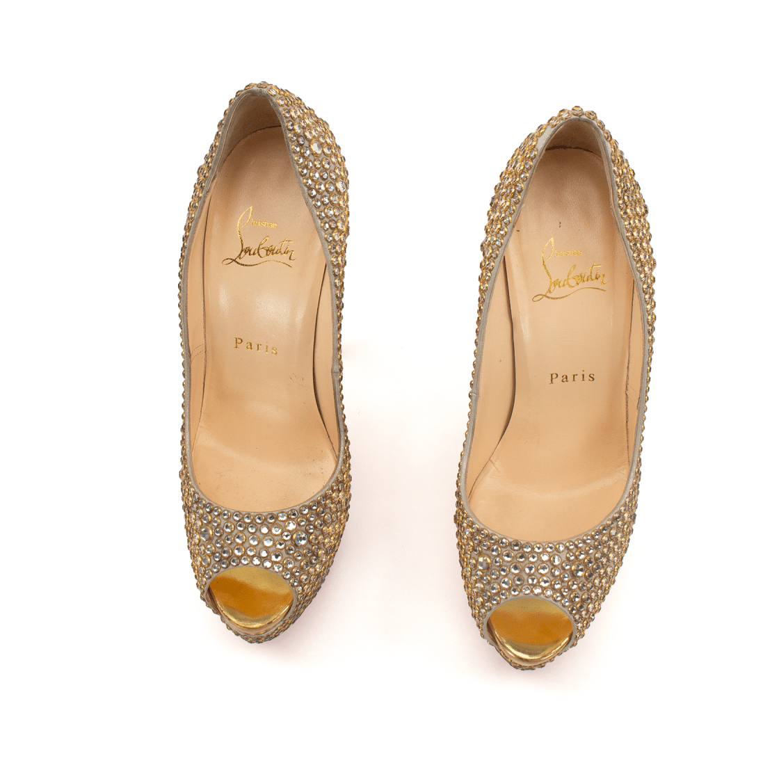 Christian Louboutin pumps from Gold & Beyond featuring sleek high-heeled shoes with signature red soles and elegant design.