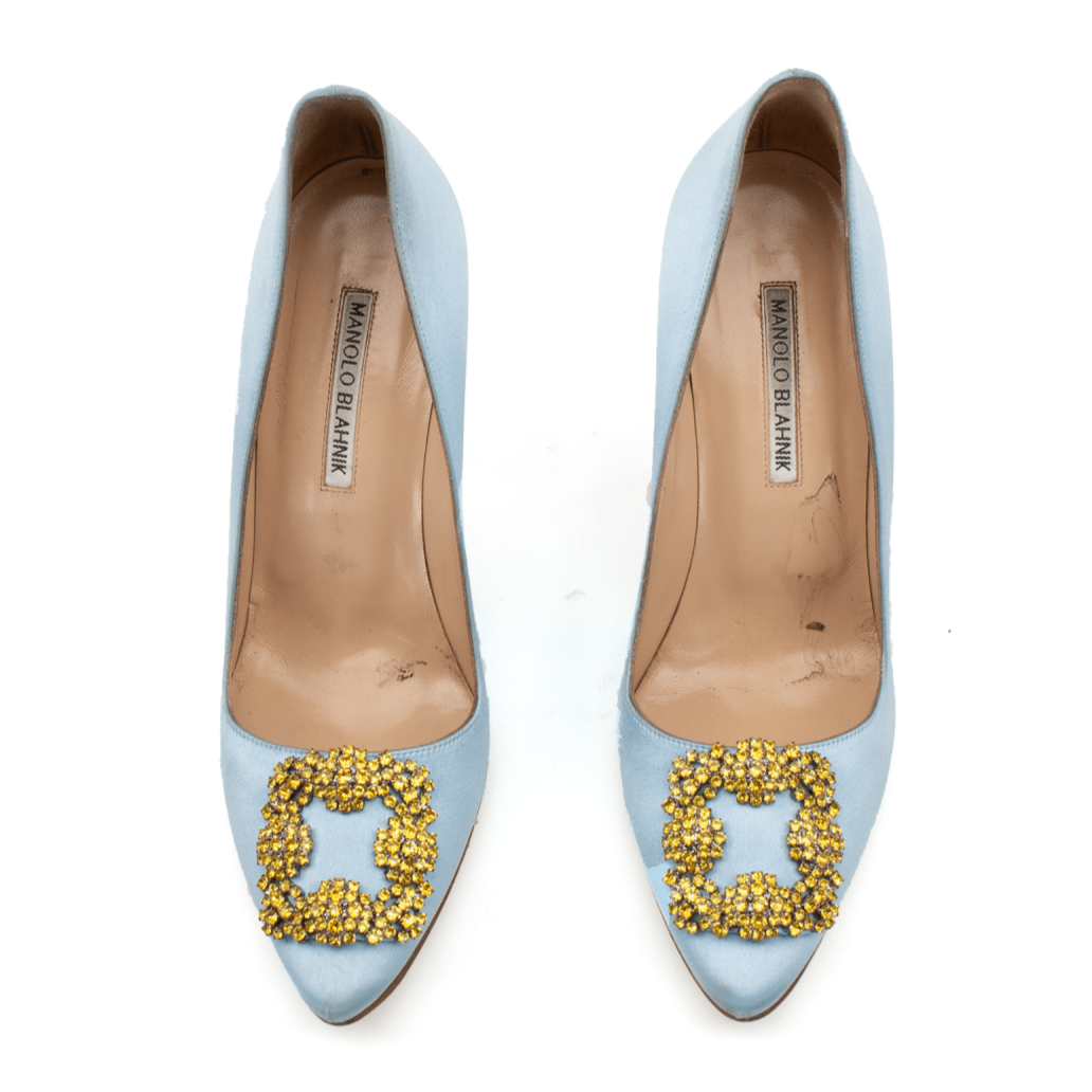 Manolo Blahnik crystal satin heels with elegant design and sparkling embellishments, showcased on a neutral background.