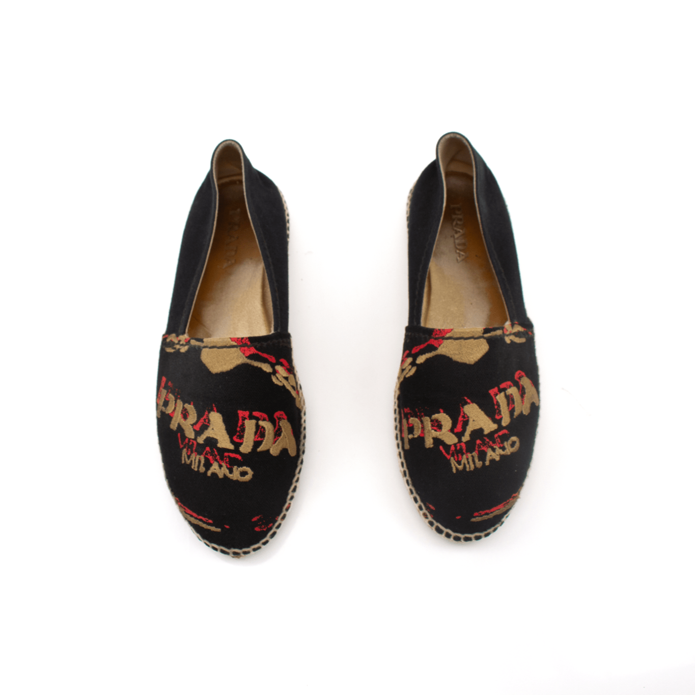 Gold & Beyond Prada canvas espadrille shoes featuring woven fabric and rubber soles, stylish and comfortable footwear for casual wear.