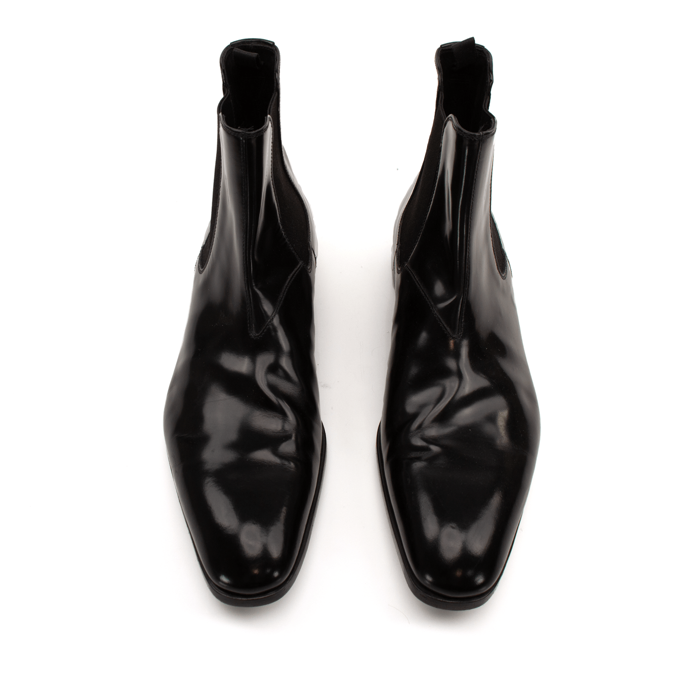 Gold & Beyond Prada men's Chelsea boots, stylish leather shoes with elastic side panels, classic ankle-high design.