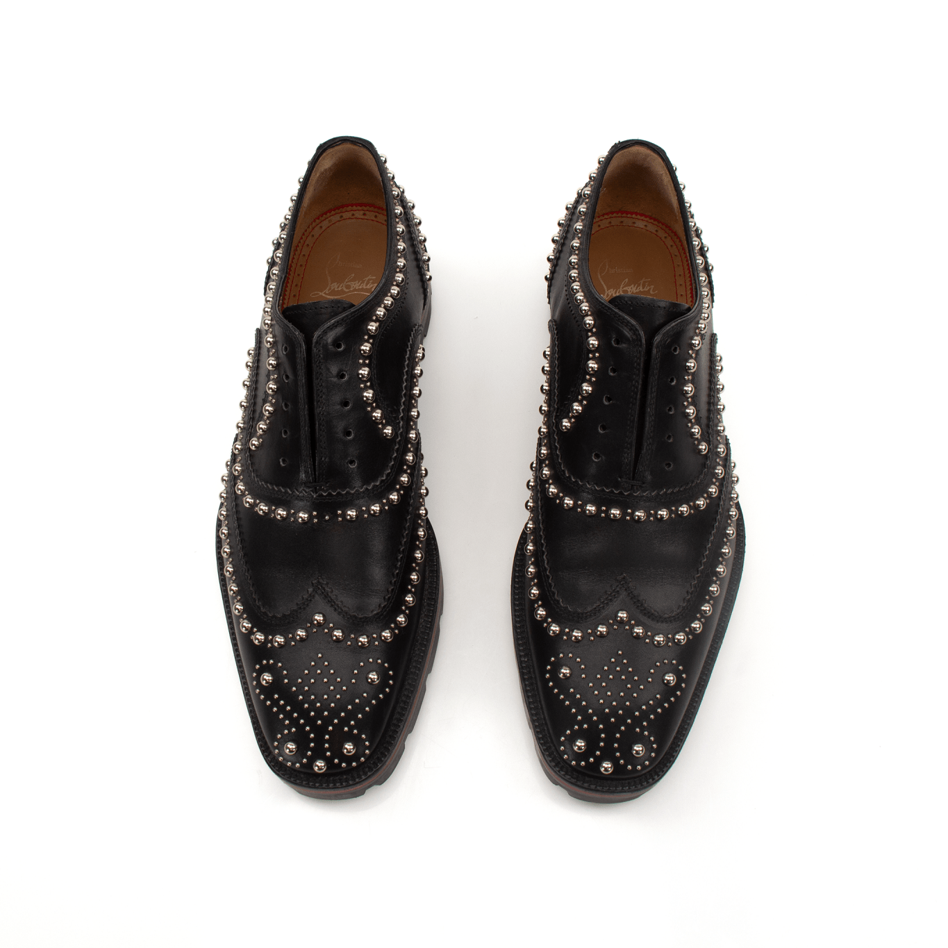 Christian Louboutin Charlie Studded Oxford shoes with black leather and silver stud accents, showcasing elegant men's footwear.