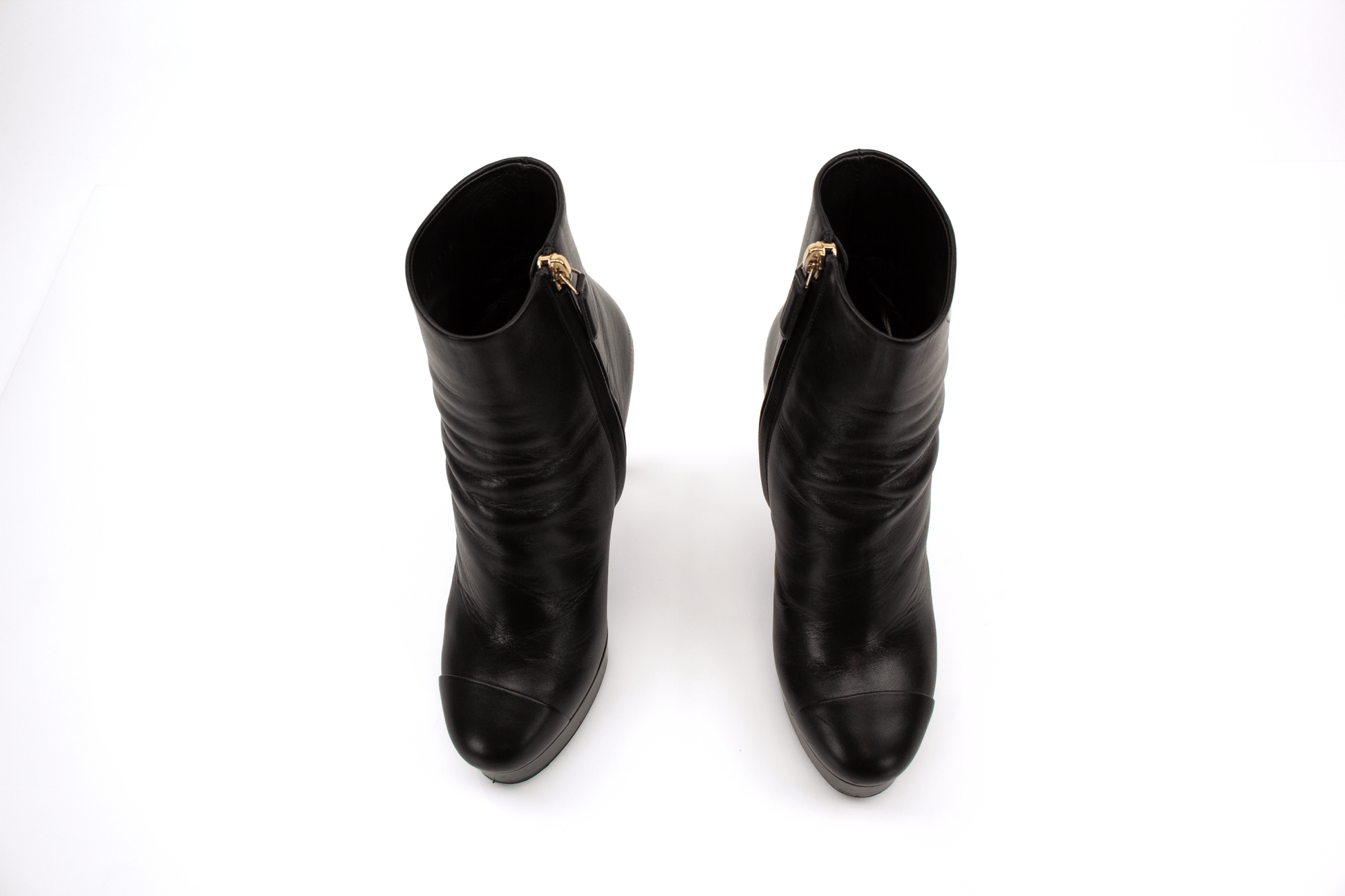 Gold & Beyond Chanel patent leather heels, stylish women's shoes with sleek shine and elegant design.