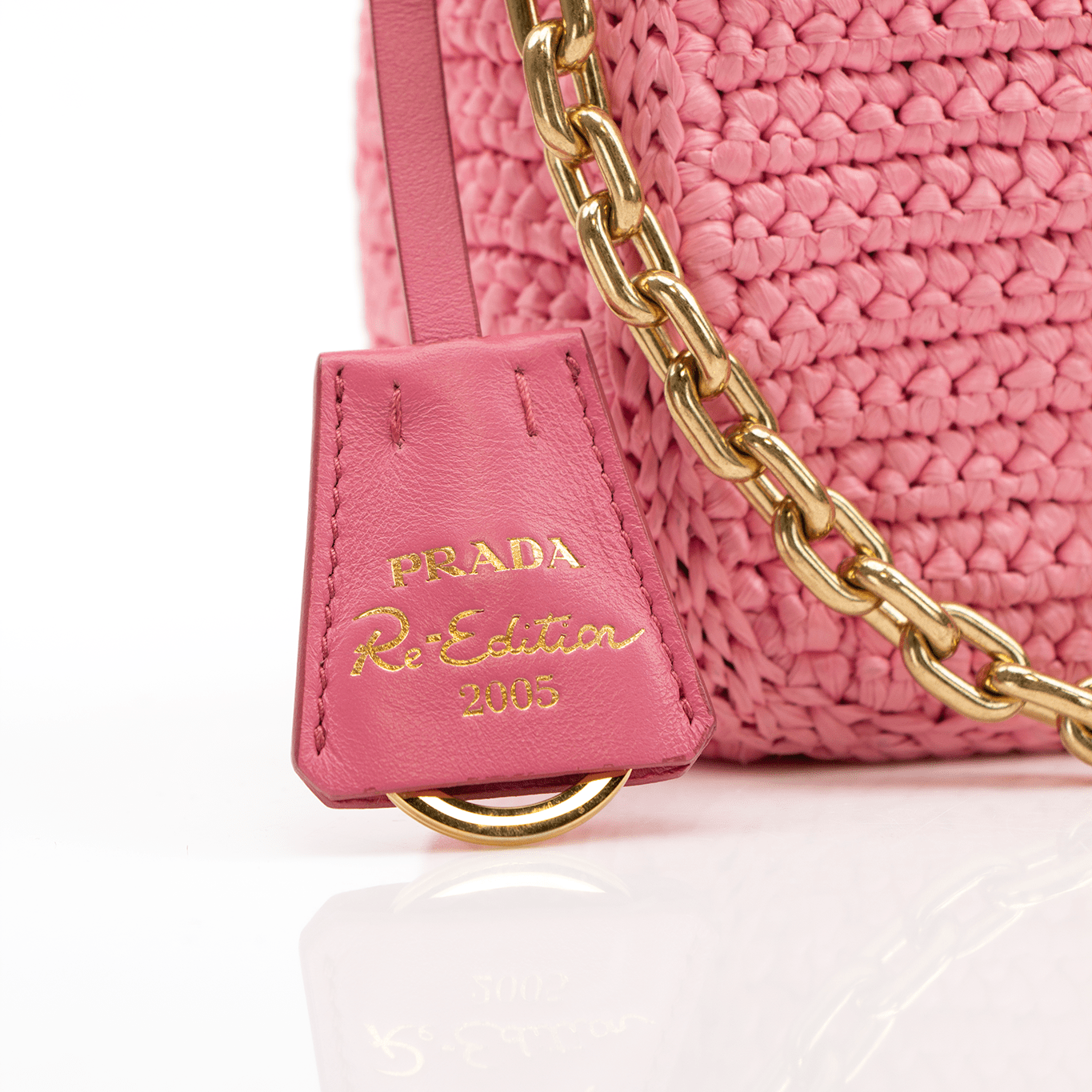 Pink Prada 2005 Re-Edition crochet handbag by Gold & Beyond, showing intricate crochet design and classic shape.