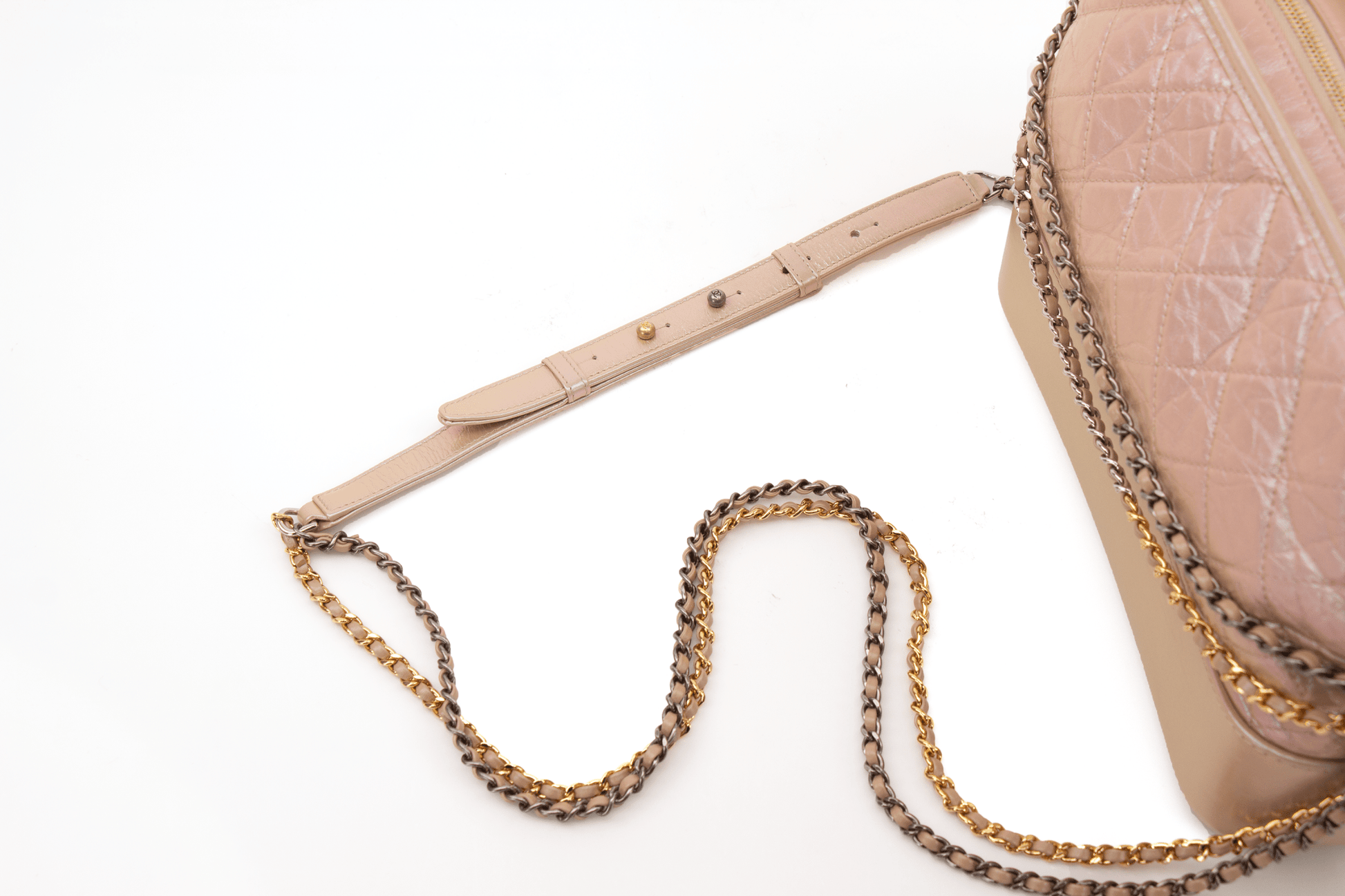 Chanel Gabrielle handbag in a stylish design, featuring a gold chain strap and elegant silhouette.