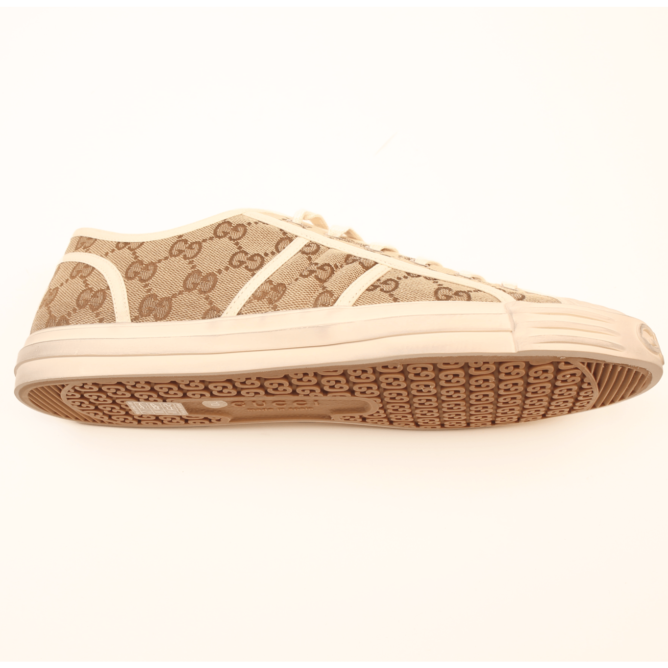 Gold & Beyond Gucci GG Supreme Sneakers, stylish shoes with signature monogram pattern and comfortable design.