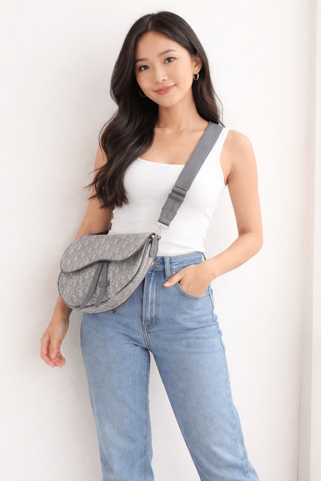 Christian Dior Oblique Saddle Bag handbag with gold hardware and adjustable strap, featuring classic Dior monogram pattern.
