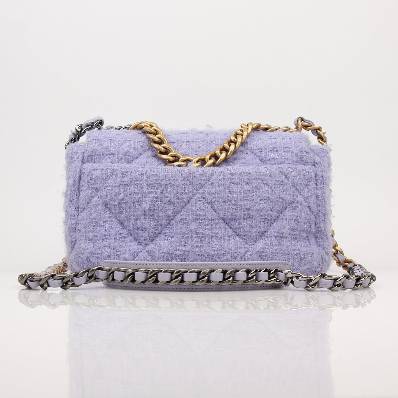 Gold & Beyond Chanel 19 Flap Bag handbag with quilted design and gold hardware, stylish accessory on a neutral background.