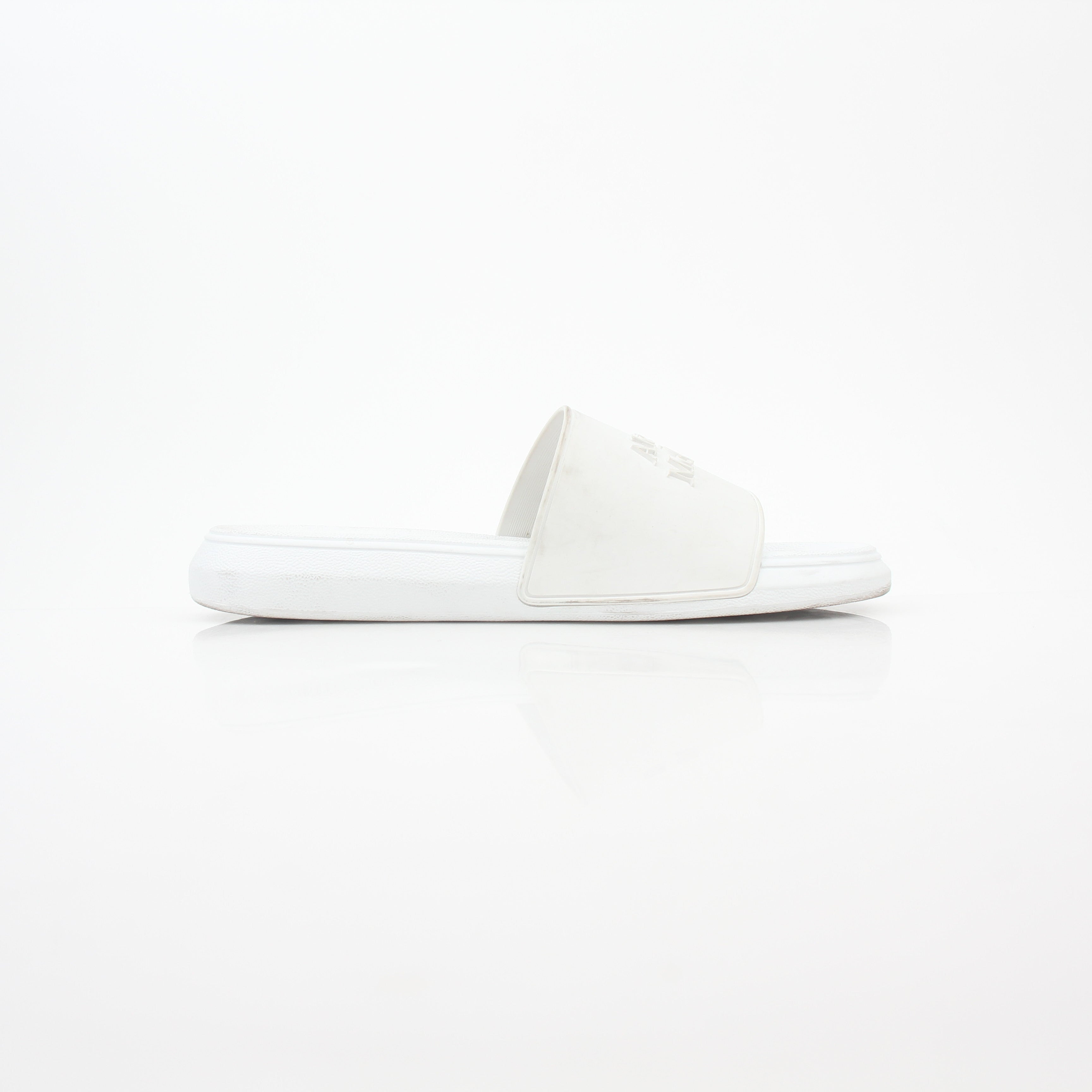 Alexander McQueen white logo pool slide sandals with open-toe design and branded strap, displayed on a neutral background