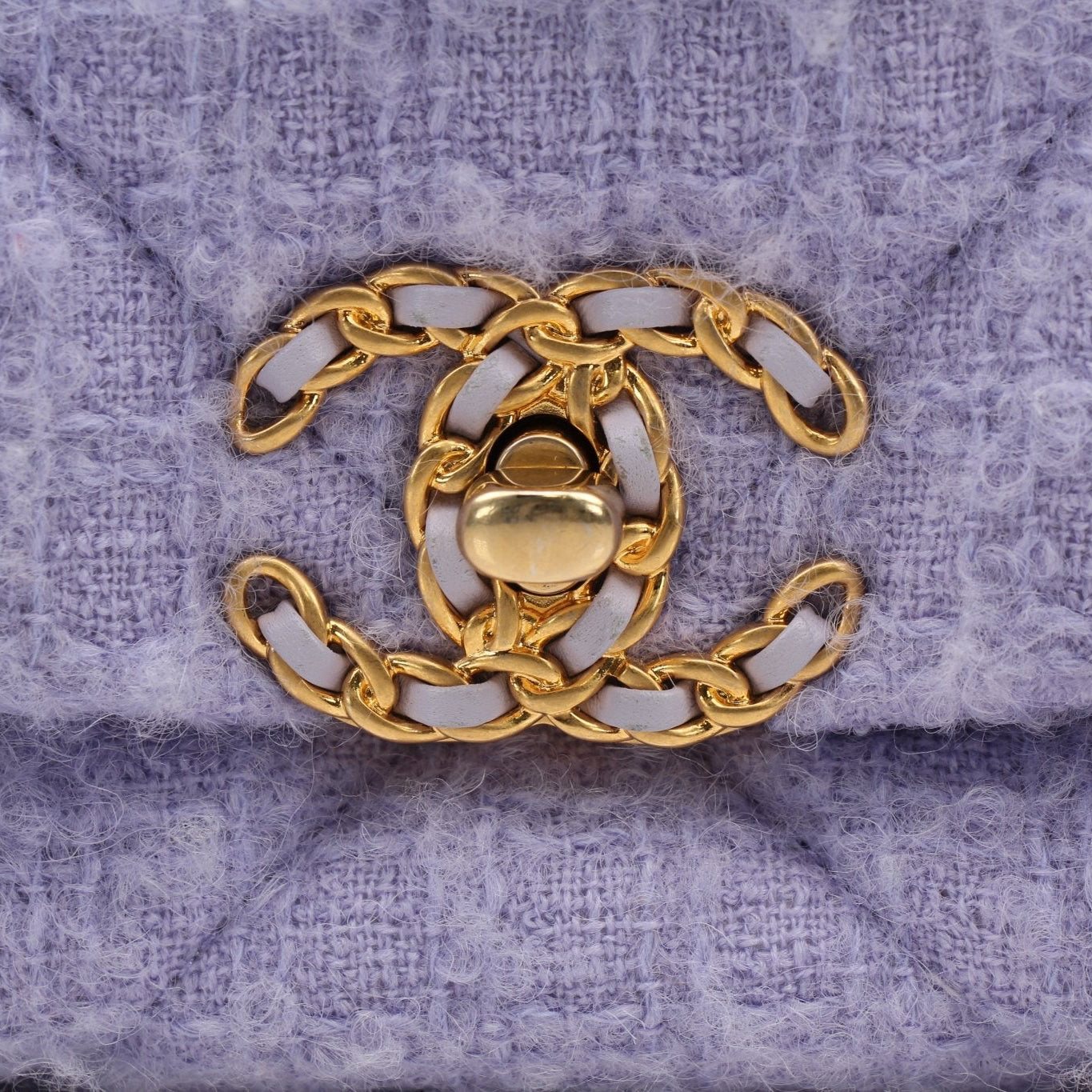 Gold & Beyond Chanel 19 Flap Handbag with quilted leather and gold hardware, displayed on a neutral background.