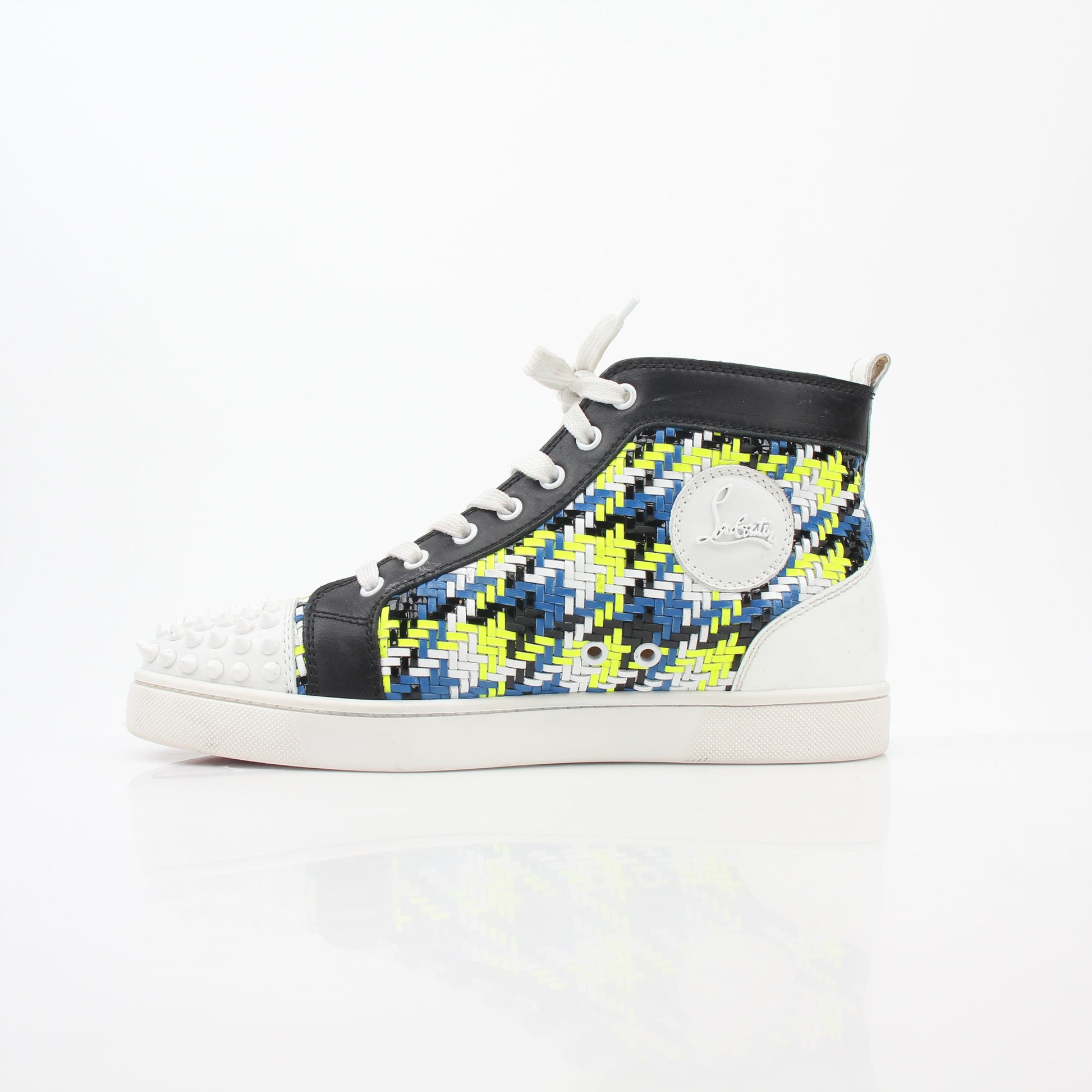 Close-up of Christian Louboutin Multicolor Louis Spikes high-top sneakers showing vibrant colors and spike details, brand logo visible.