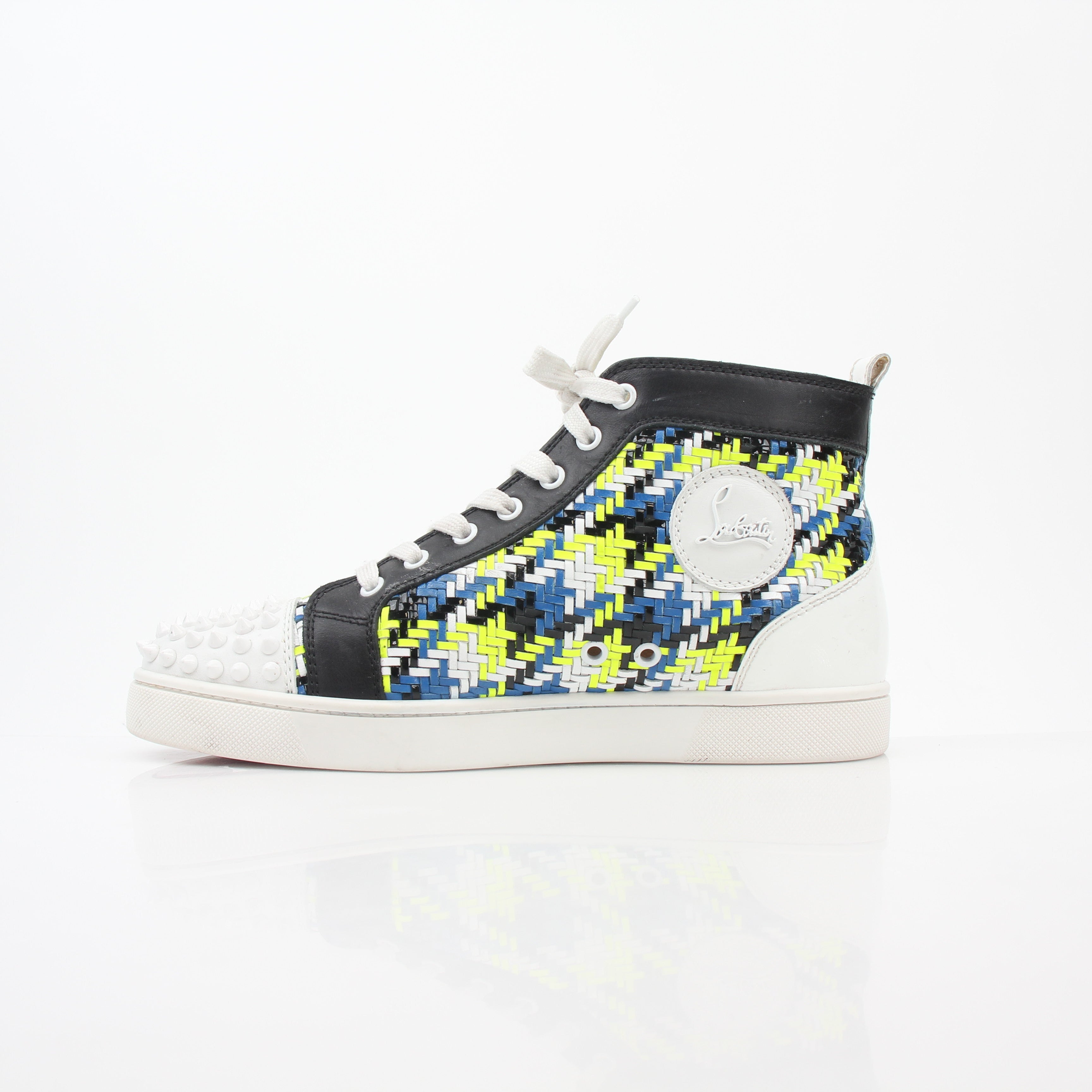 Close-up of Christian Louboutin Multicolor Louis Spikes high-top sneakers showing vibrant colors and spike details, brand logo visible.