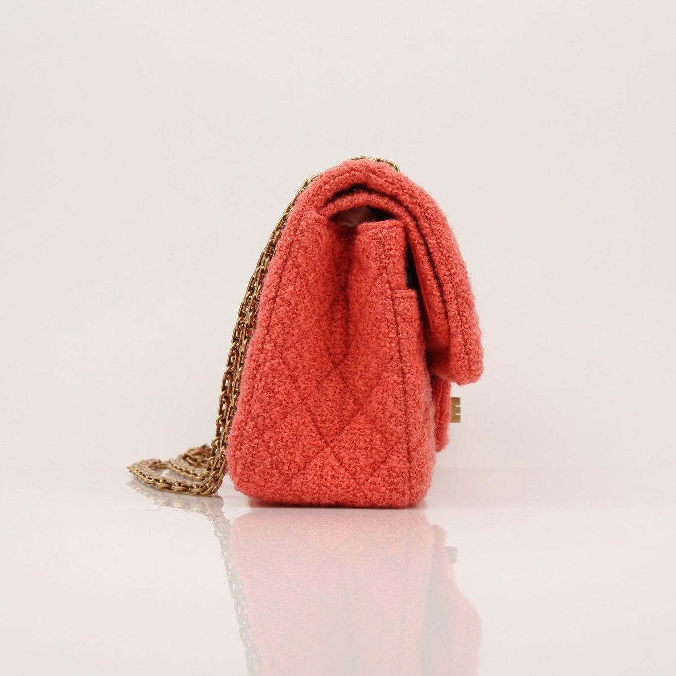 Gold & Beyond Chanel Tweed Re-Issue Flap Handbag with gold chain strap and classic quilted design.