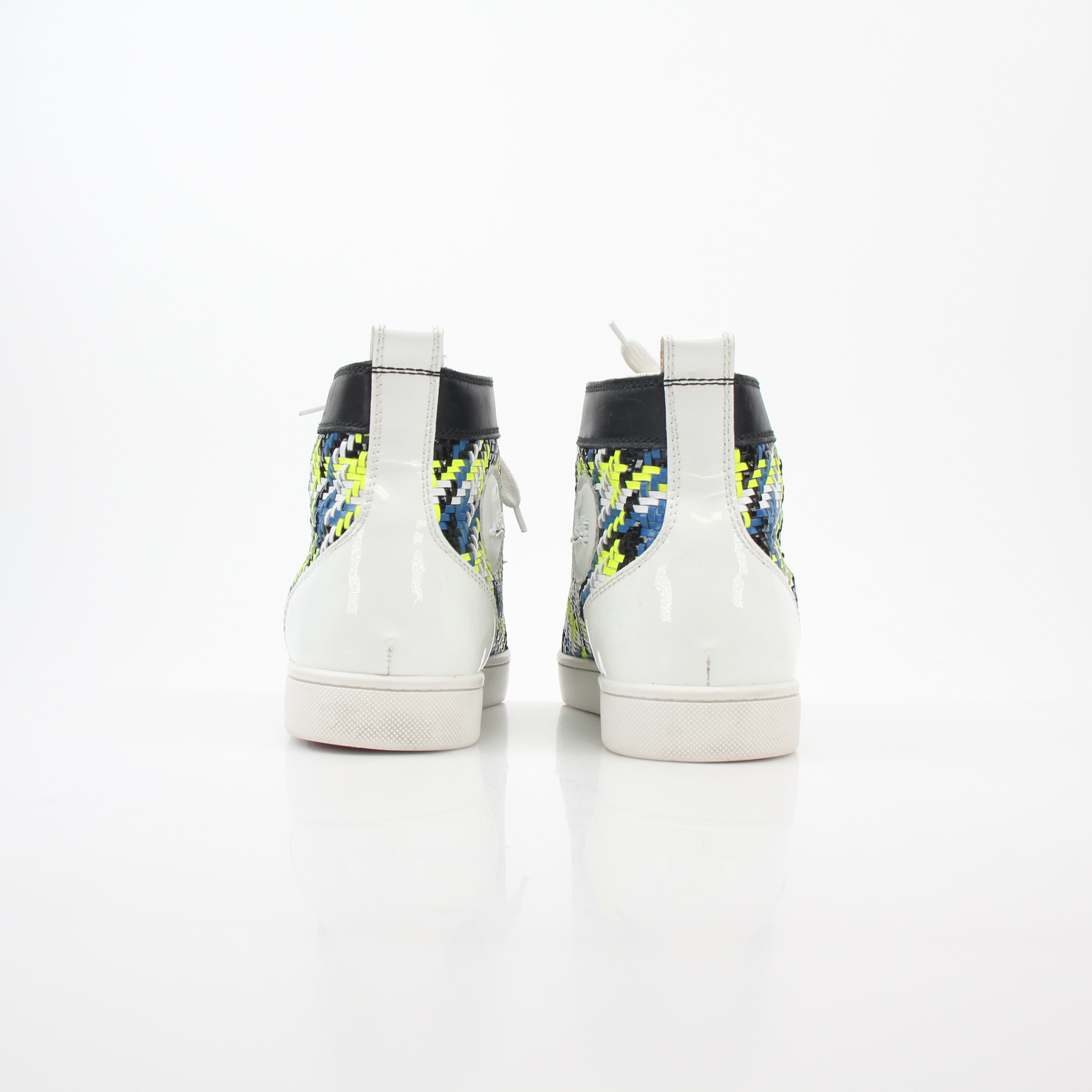 Close-up of Christian Louboutin Multicolor Louis Spikes high-top sneakers showing vibrant spikes and detailed shoe texture.