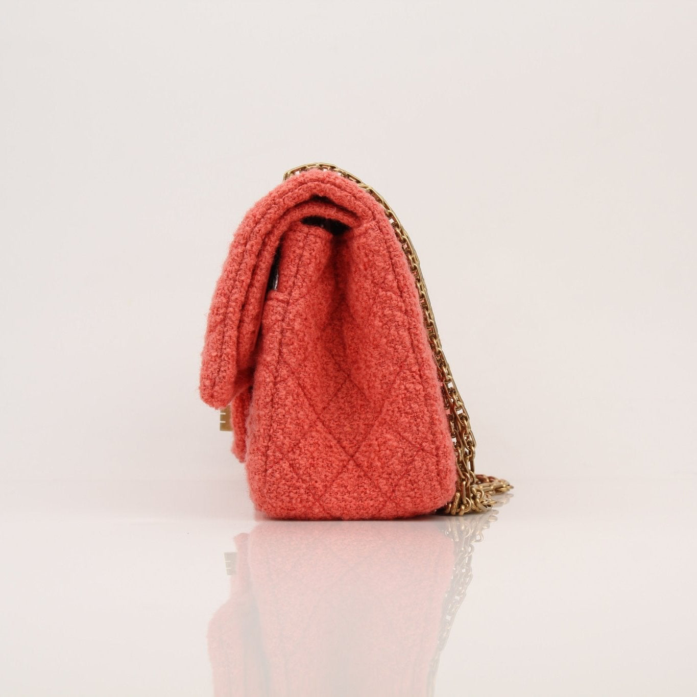 Gold & Beyond Chanel Tweed Re-Issue Flap Handbag with Chain strap, showcasing classic quilted design and elegant style.