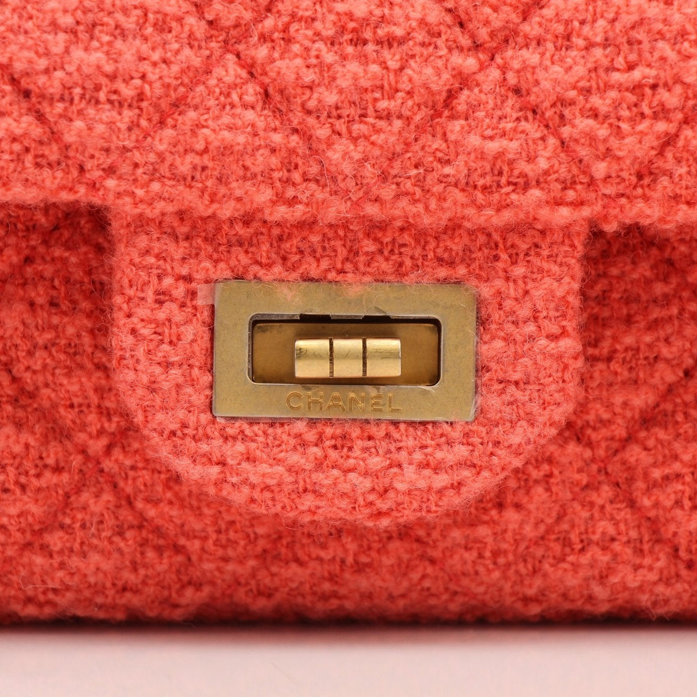 Gold & Beyond Chanel Tweed Re-Issue Flap Handbag with chain strap and classic quilted design, shown on a neutral background.