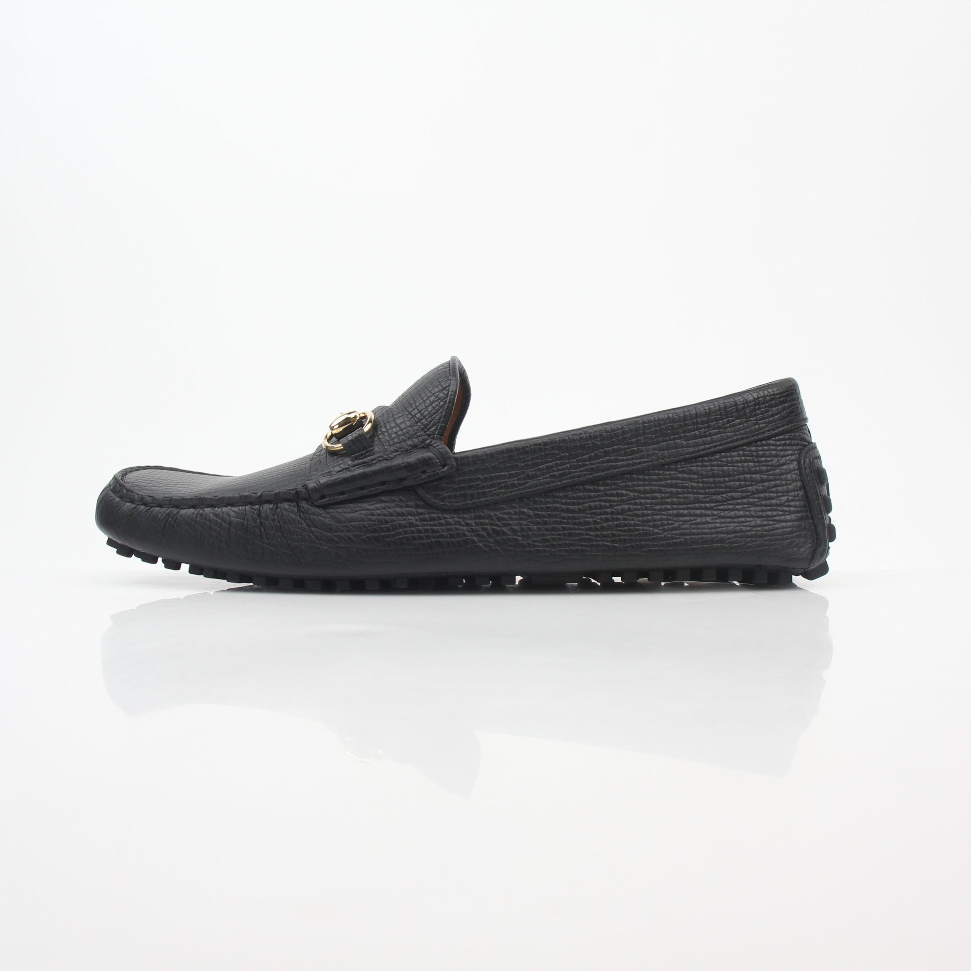 Gucci black leather Ayrton horsebit driving loafers for men, featuring sleek leather construction and signature horsebit detail.