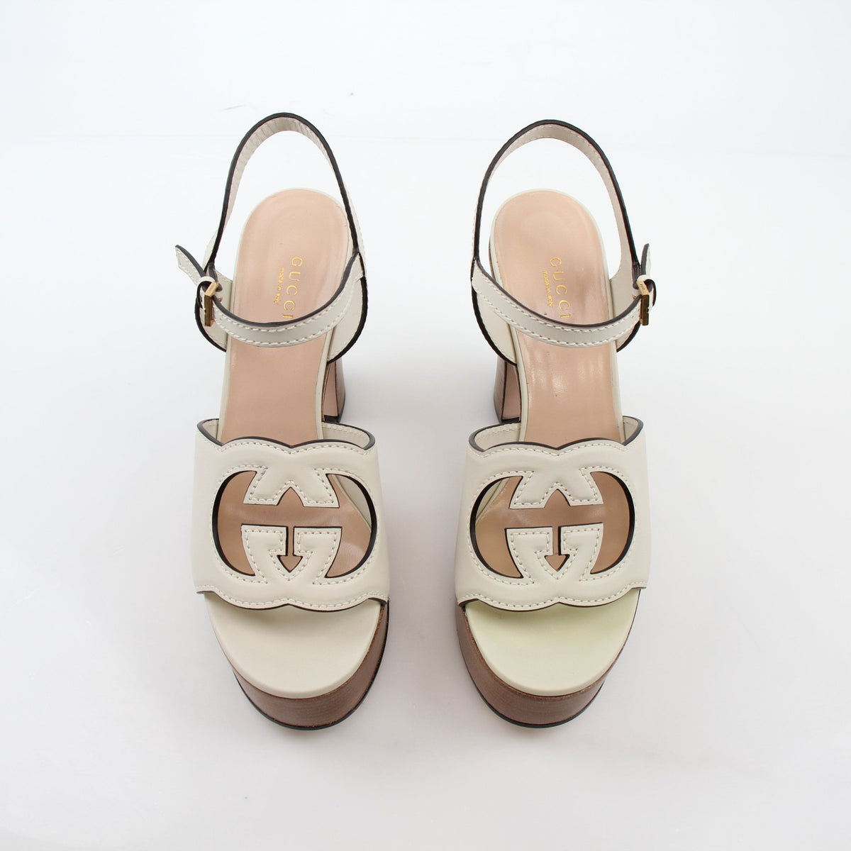 Gucci Ivory Interlocking G cutout platform heels with ankle straps and chunky sole, designed by Gold & Beyond.