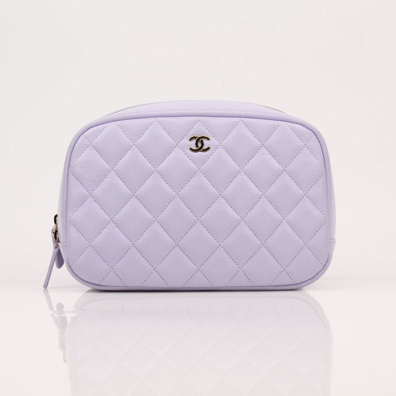 Gold & Beyond Chanel Vanity Top Zipper Bag handbag with sleek design and gold accents, displayed on a neutral background.