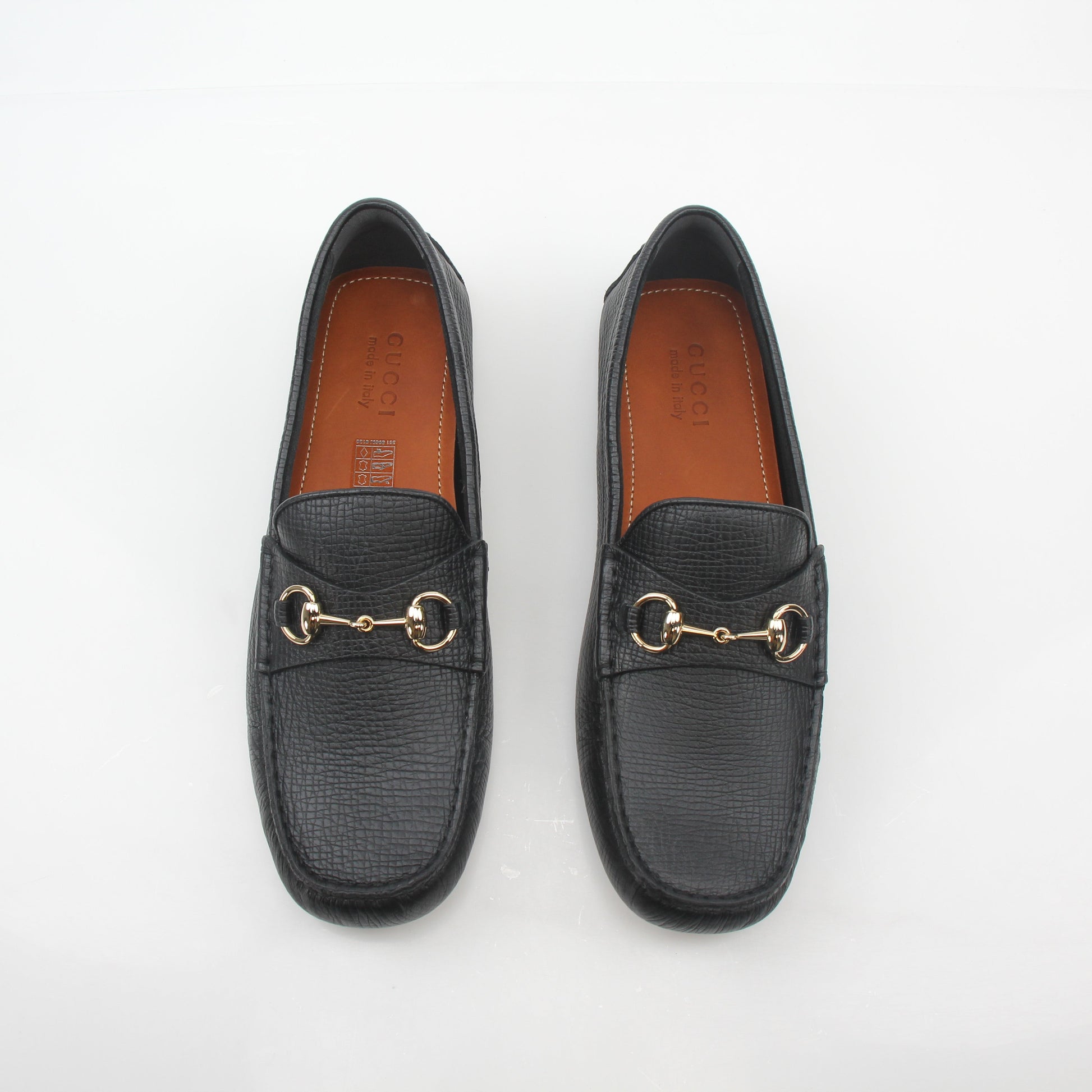 Gucci black leather Ayrton horsebit driving loafers for men, featuring classic horsebit detail and sleek leather design.