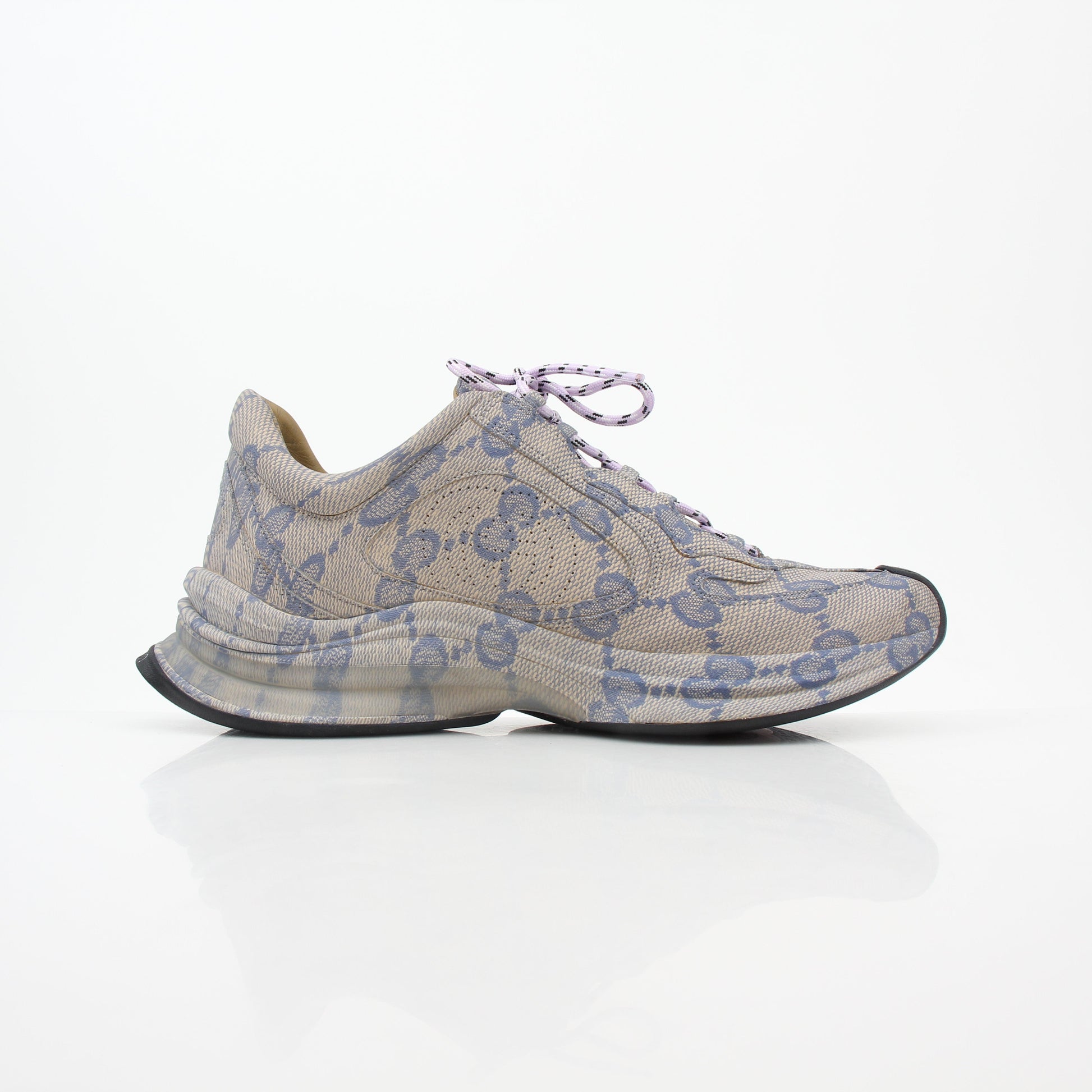 Beige Gucci GG Monogram Run sneakers with gold accents, stylish shoes from Gold & Beyond featuring signature logo design.