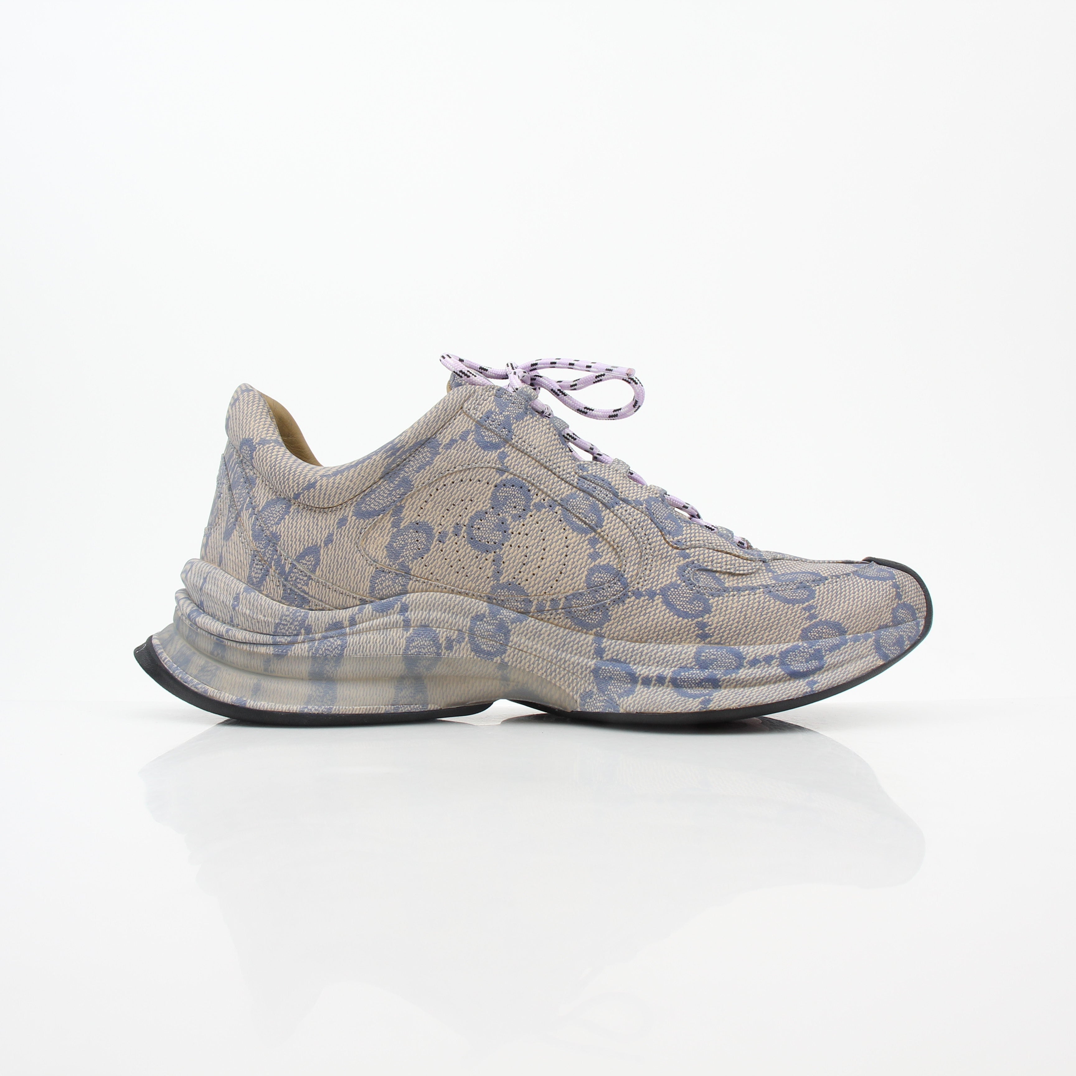 Beige Gucci GG Monogram Run sneakers with gold accents, stylish shoes from Gold & Beyond featuring signature logo design.
