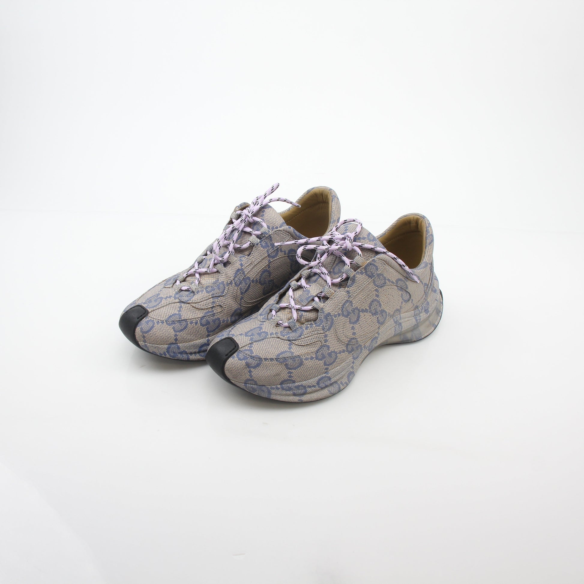 Gucci beige GG monogram Run sneakers, shoes with beige fabric and white rubber sole, stylish designer footwear by Gold & Beyond.