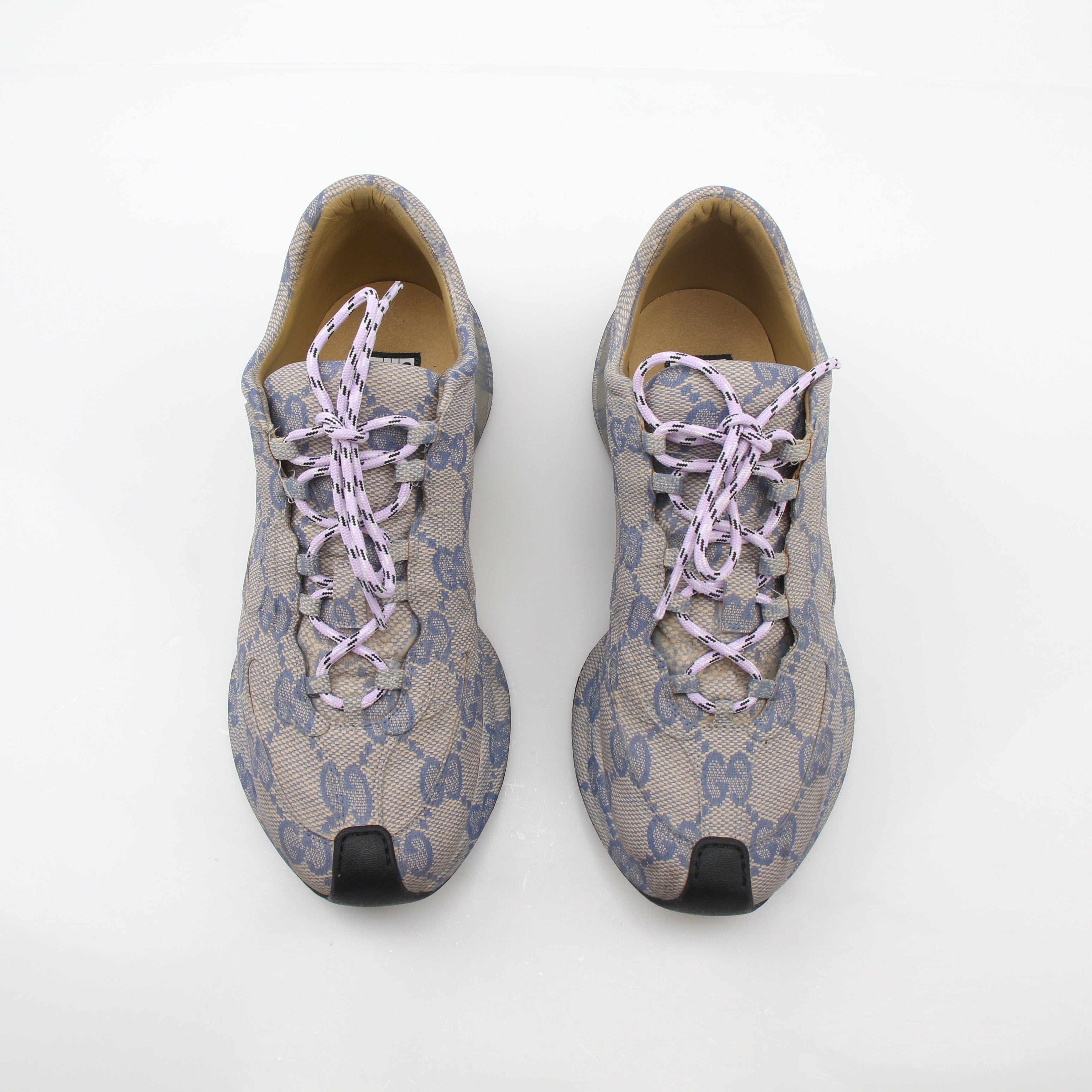 Gucci beige GG monogram Run sneakers with white soles and gold accents, stylish shoes from Gold & Beyond.