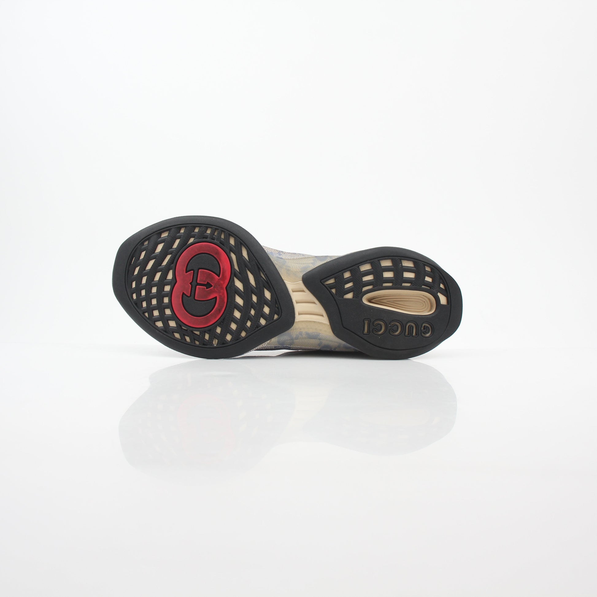 Gucci beige GG monogram run sneakers with white soles and beige laces, showcasing a stylish casual shoe design.