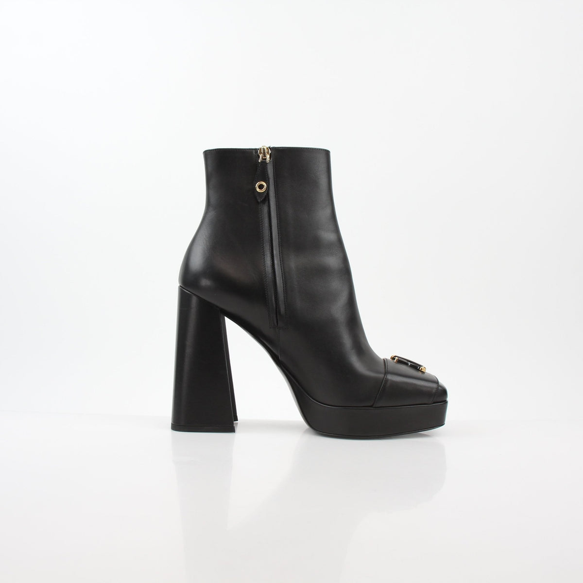 Louis Vuitton black Shake platform ankle boots with chunky soles and sleek design, displayed on a neutral background.