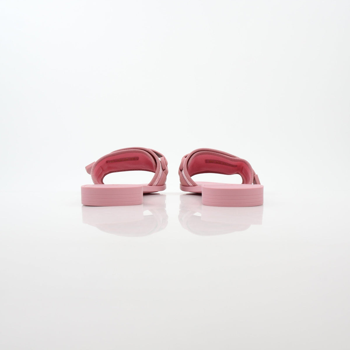 Pink Dioriviera Dio(r)evolution slides by Christian Dior featuring pink straps and Dior branding, displayed on a neutral background.