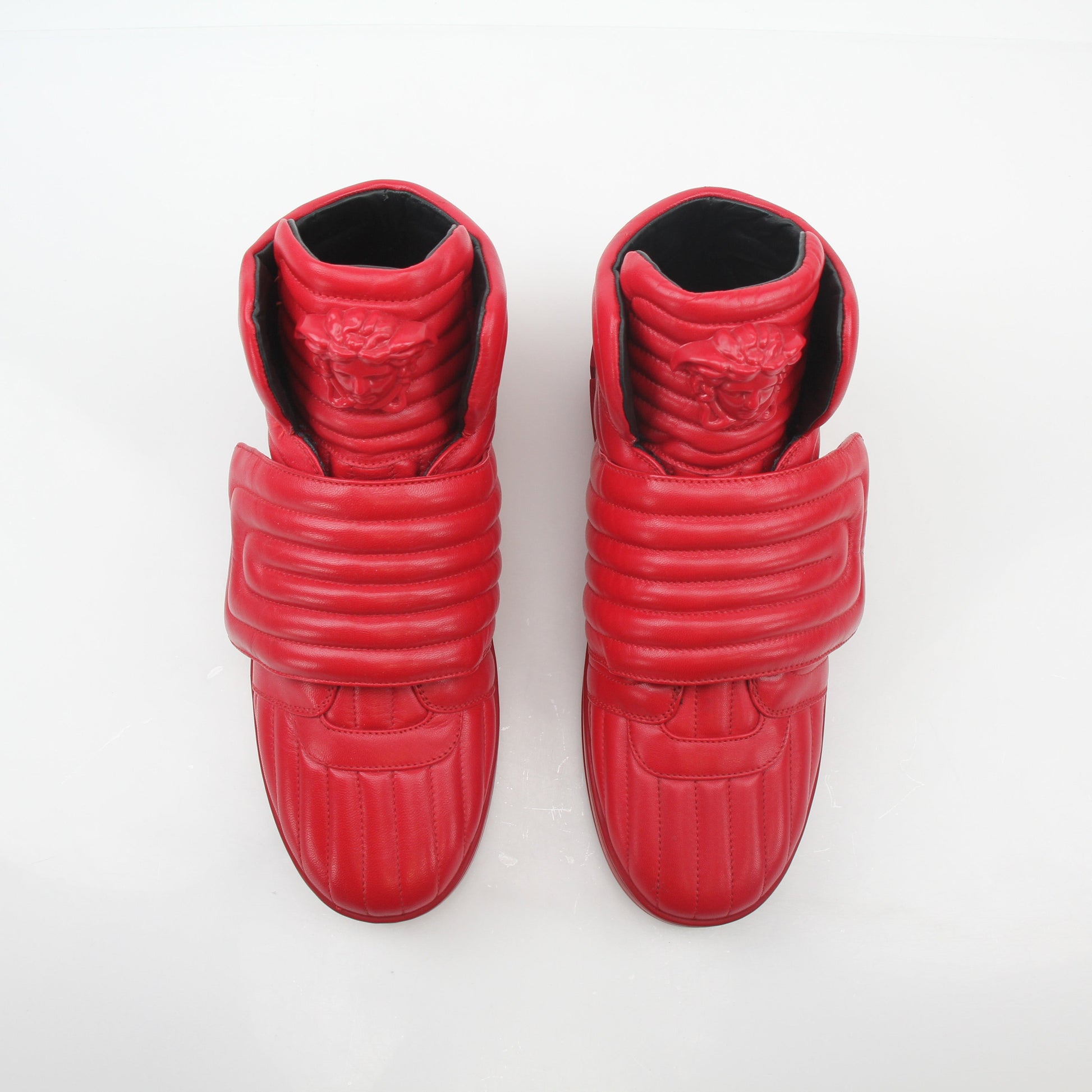 Gold & Beyond Versace Red Aros quilted leather high-top sneakers with stylish design and high-top shoe silhouette.