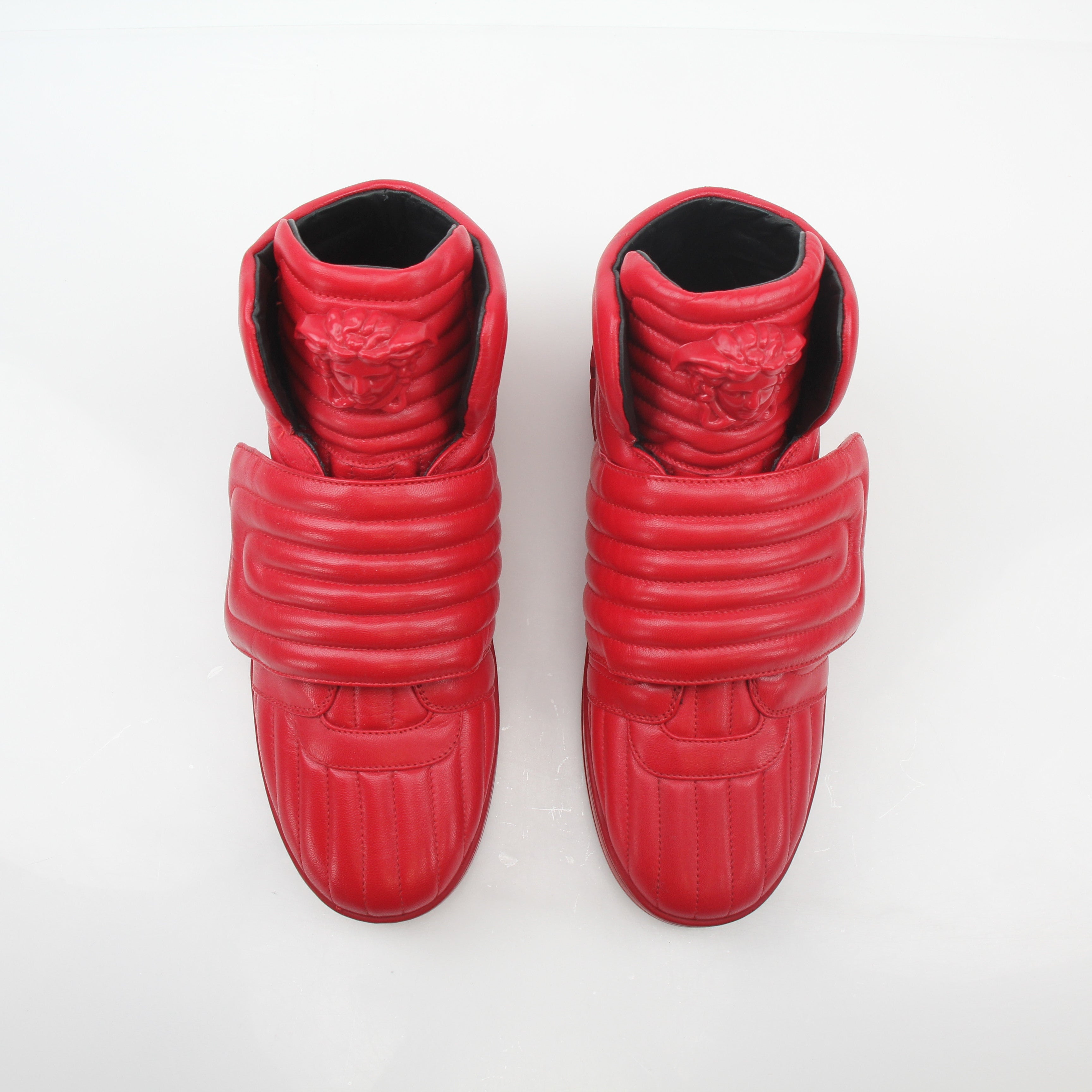 Gold & Beyond Versace Red Aros quilted leather high-top sneakers with stylish design and high-top shoe silhouette.
