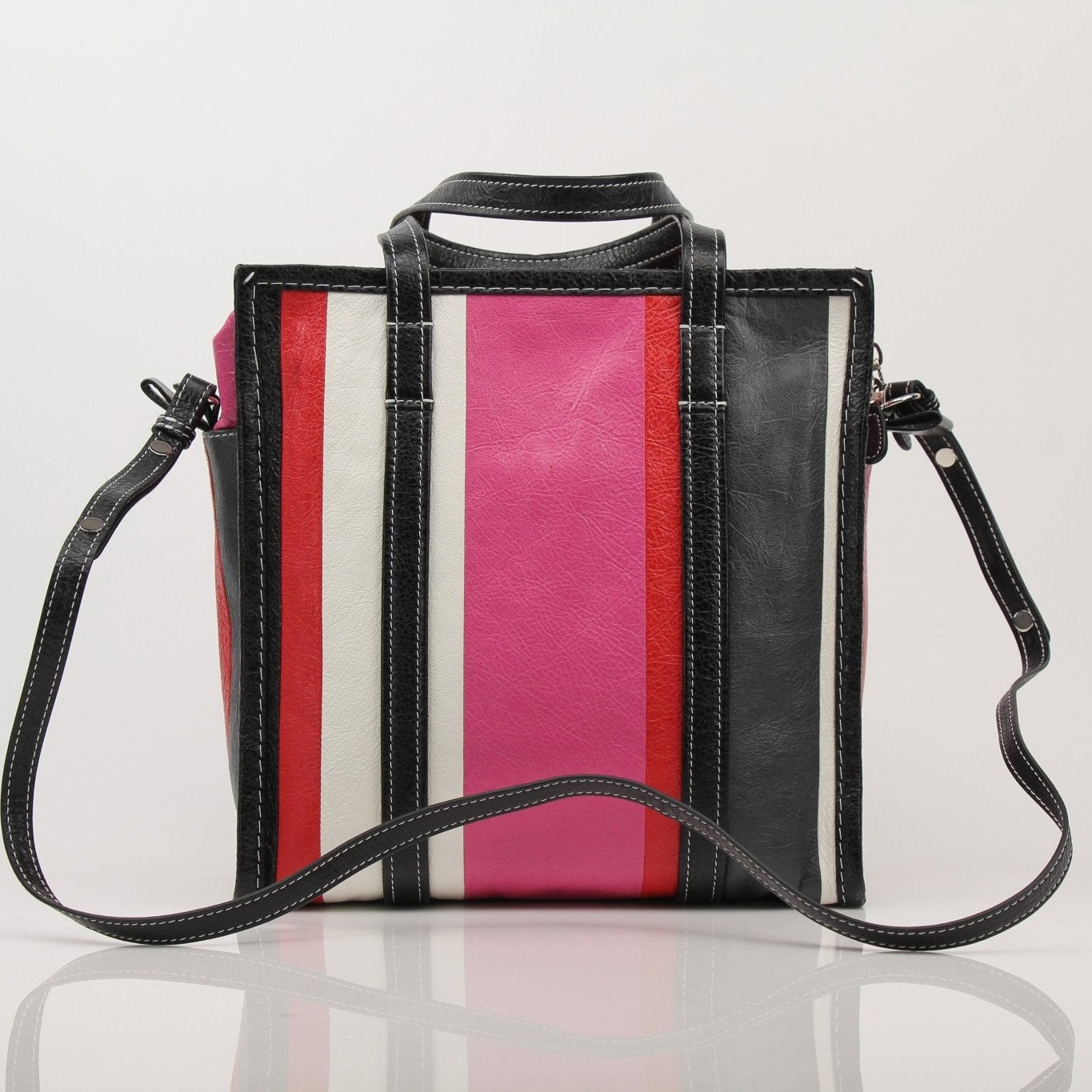 Gold & Beyond Balenciaga Agnes Bazar Papier Tote travel bag with sturdy handles and spacious interior.