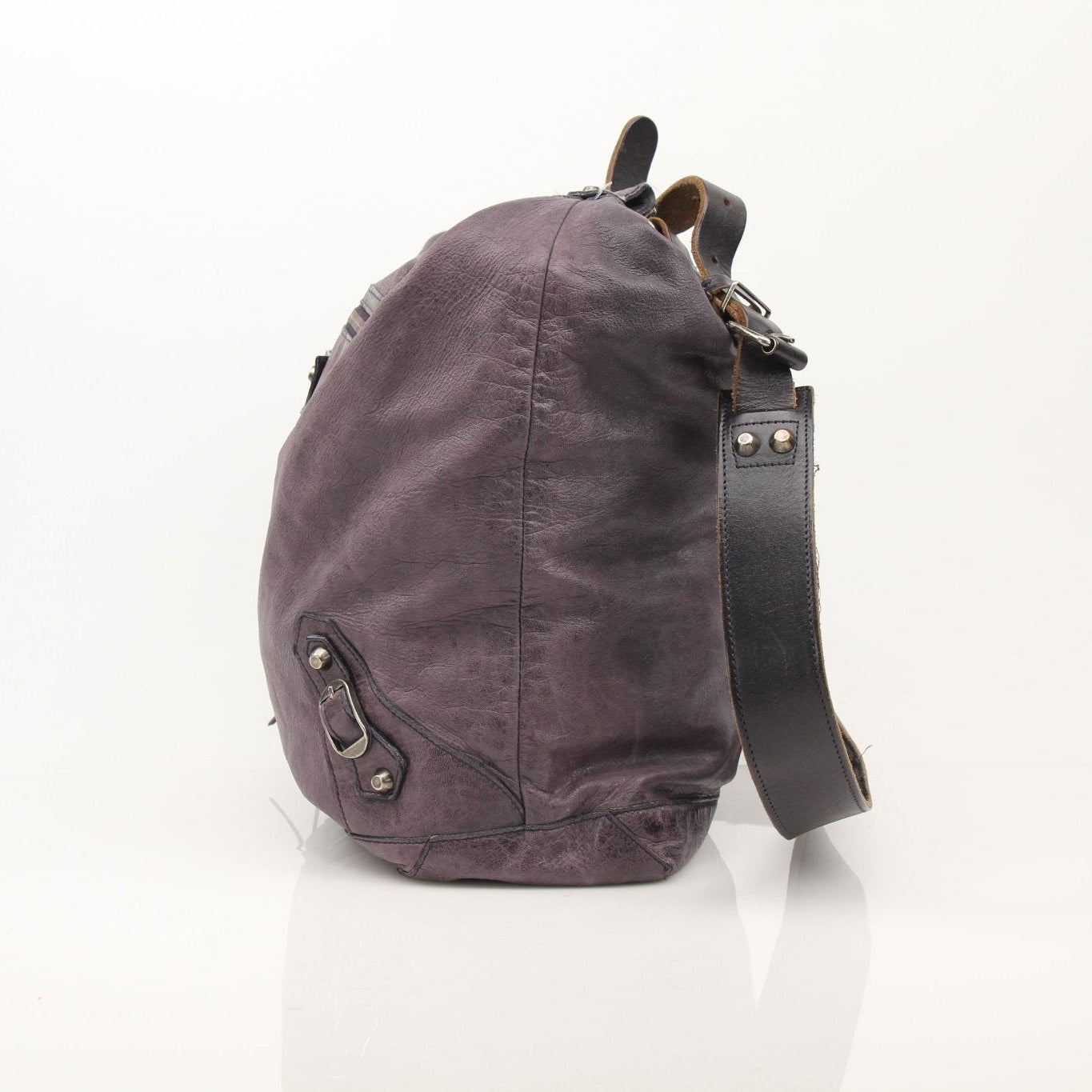 Purple distressed Balenciaga messenger handbag with adjustable strap and signature design, stylish and spacious for everyday use.