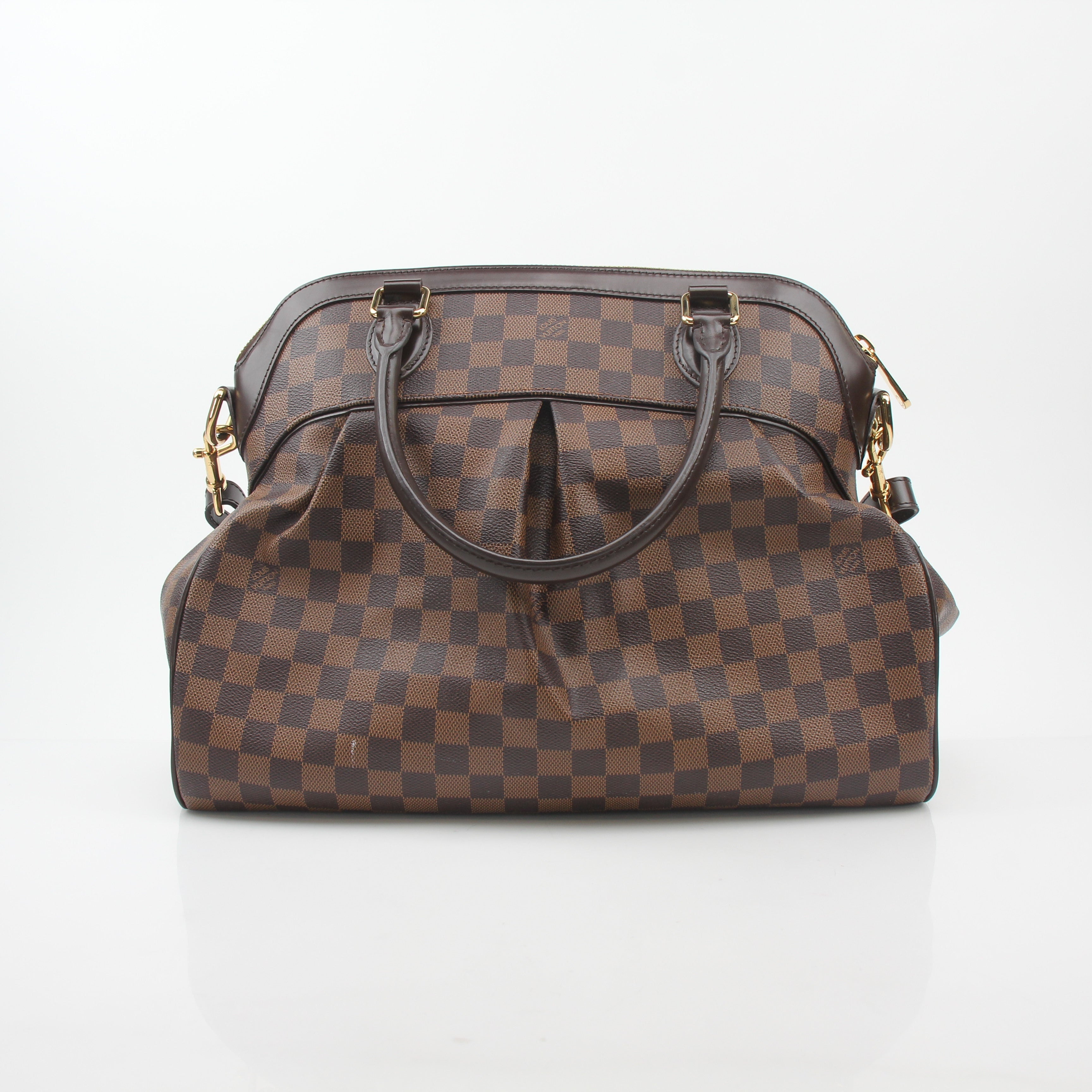 Louis Vuitton Damier Ebene Trevi GM handbag with leather handles and gold-tone hardware, showcasing classic checkerboard pattern.