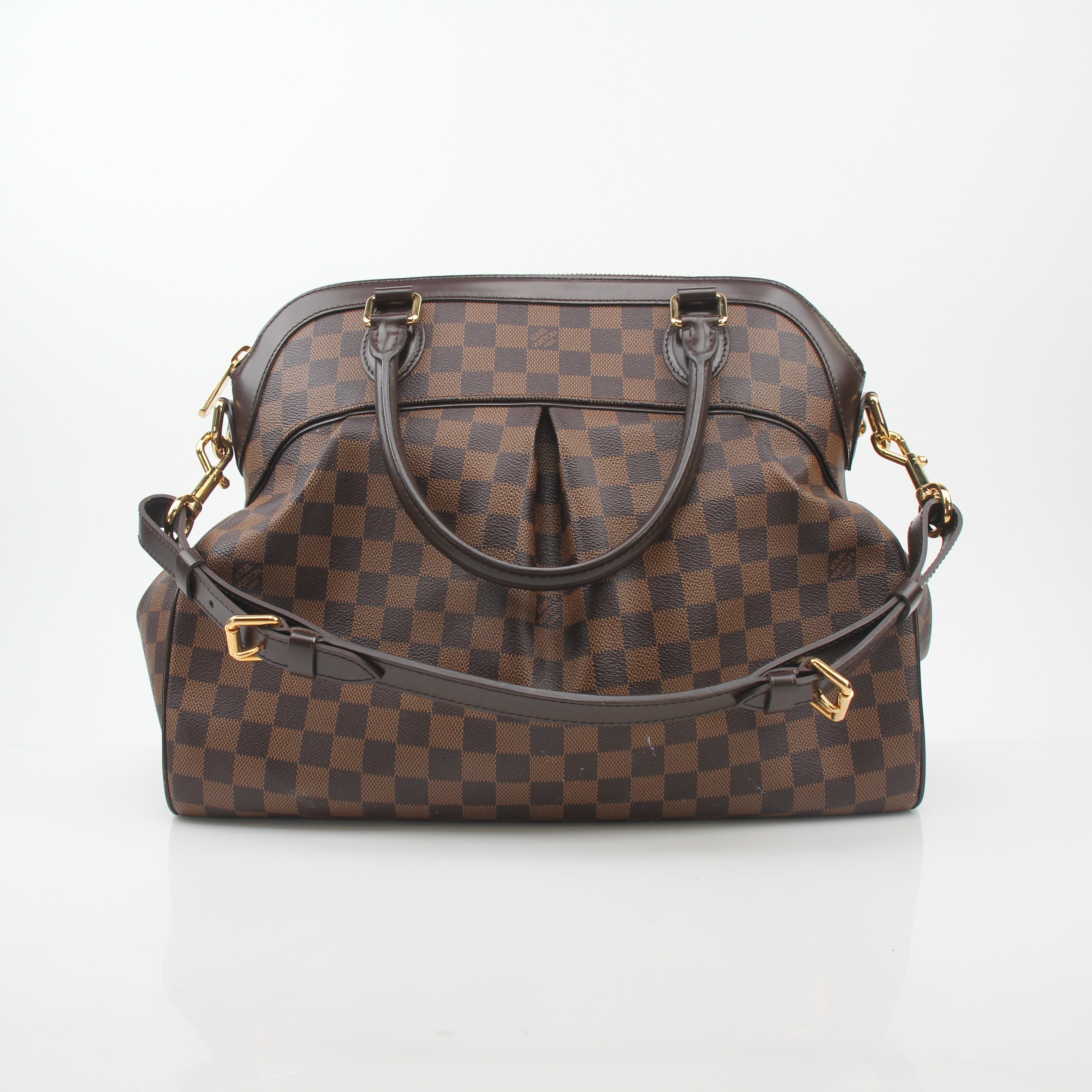 Louis Vuitton Damier Ebene Trevi GM handbag with leather trim and gold-tone hardware, shown in a close-up view.