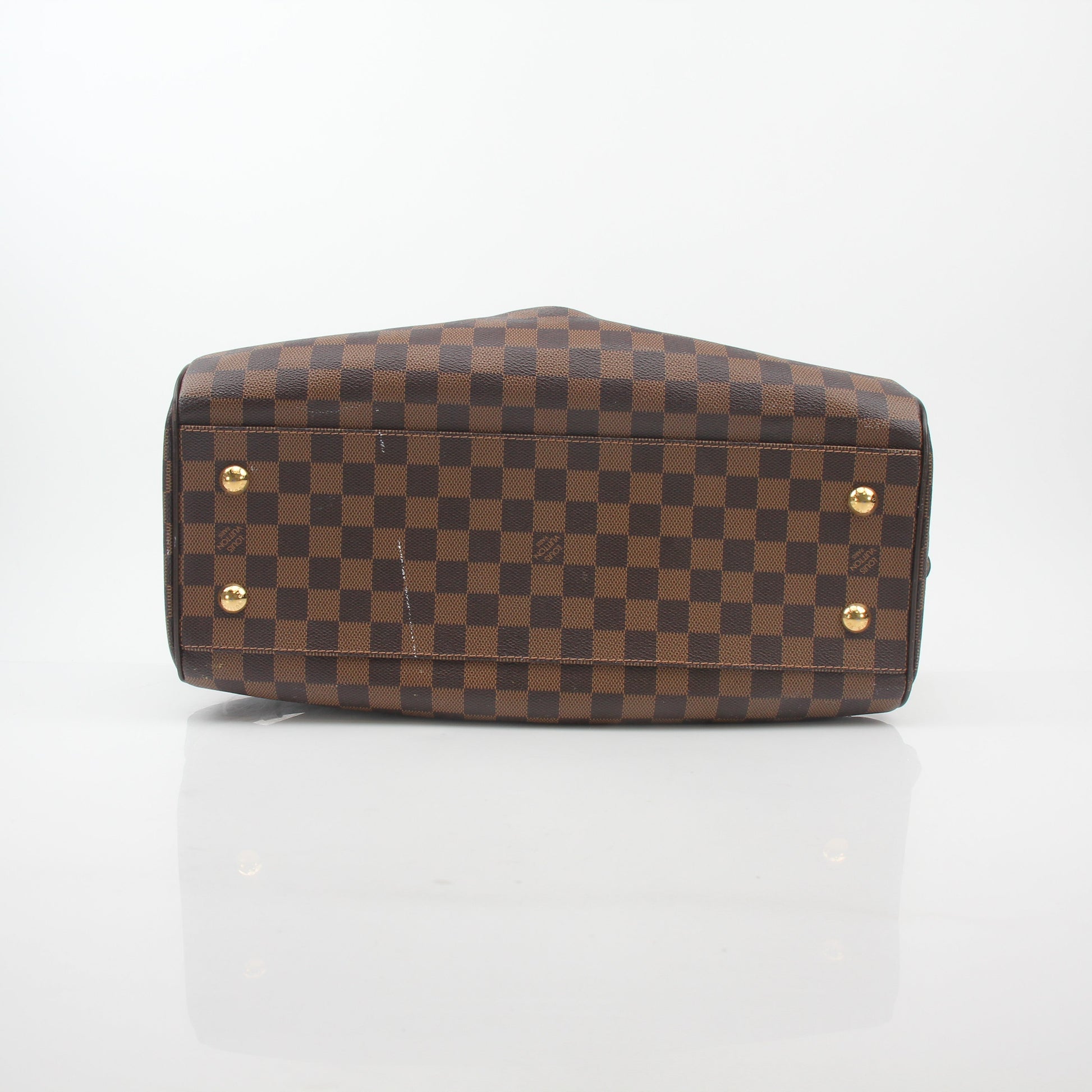 Louis Vuitton Damier Ebene Trevi GM handbag with gold hardware and leather handles, detailed fabric pattern, and spacious interior.