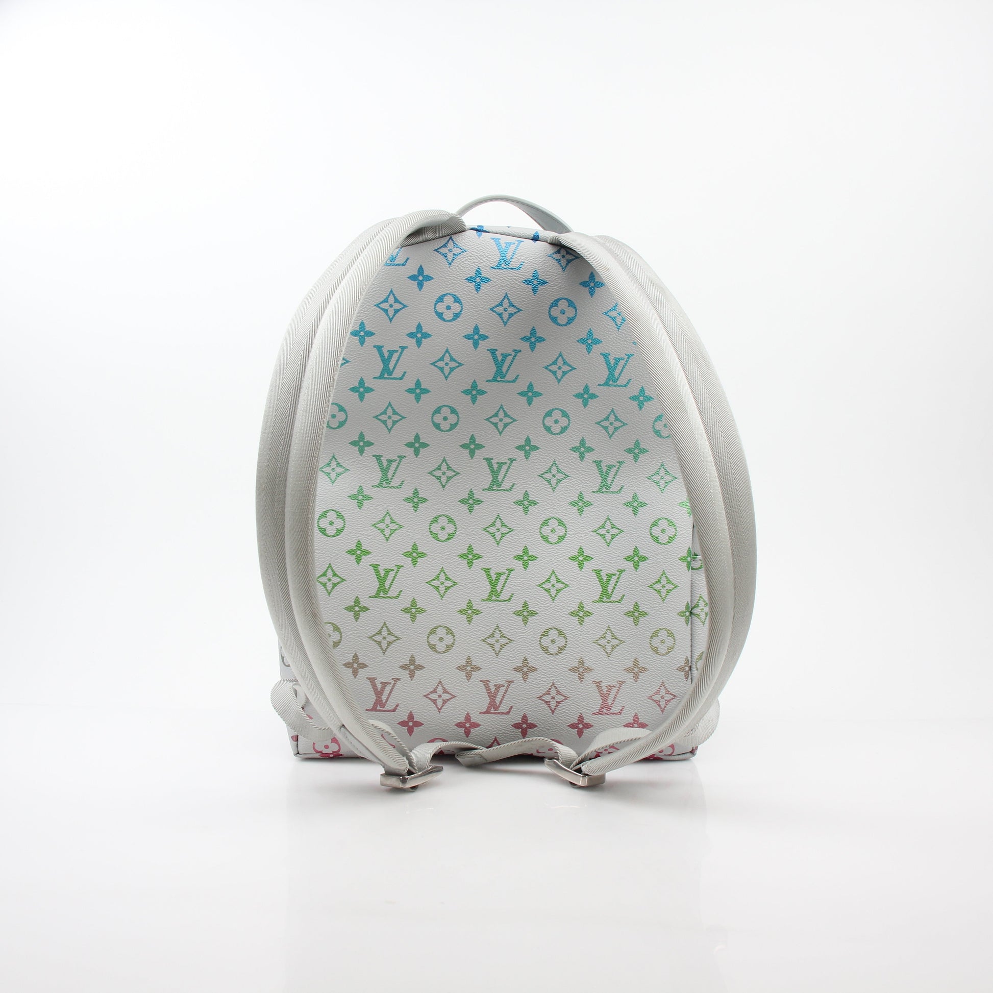 Louis Vuitton Iridescent Monogram Discovery Backpack PM, luxury travel bag with shiny monogram design and adjustable straps.