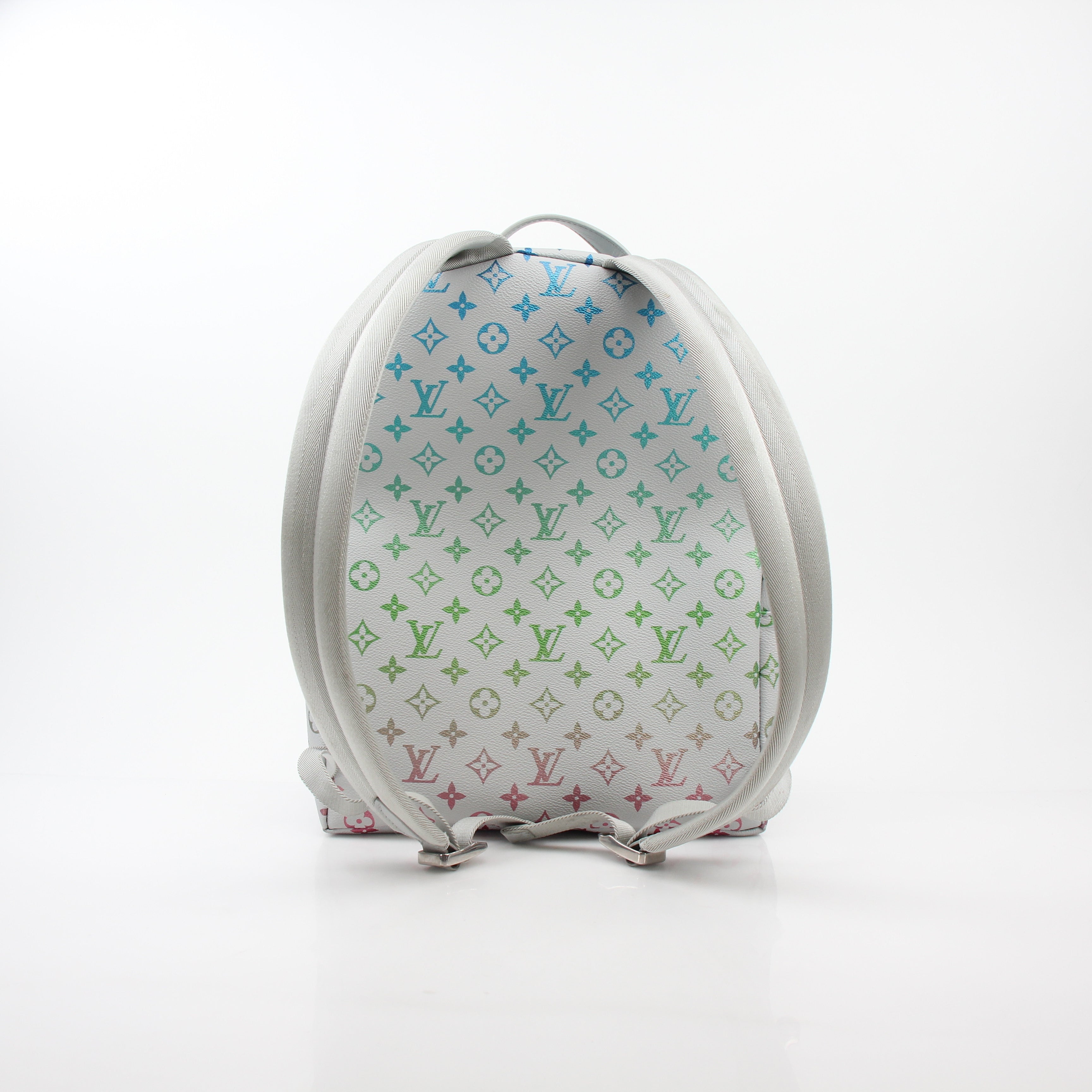 Louis Vuitton Iridescent Monogram Discovery Backpack PM, luxury travel bag with shiny monogram design and adjustable straps.
