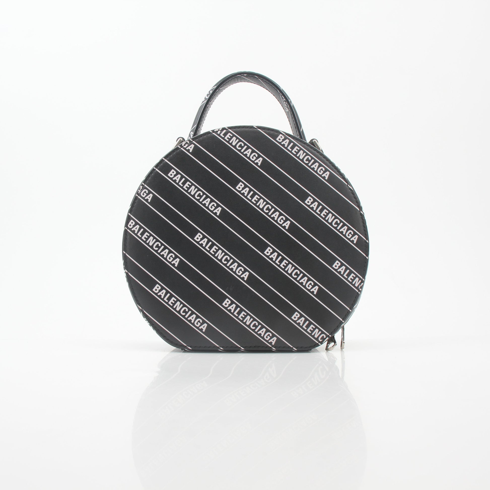 Black Balenciaga XS Vanity round handbag with logo detail, featuring a compact, stylish design in the image.