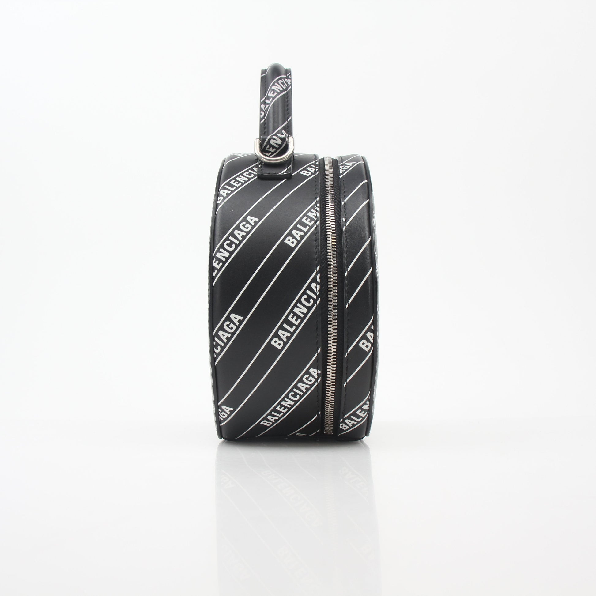 Black Balenciaga logo XS Vanity round handbag with gold accents, compact and stylish for everyday use.
